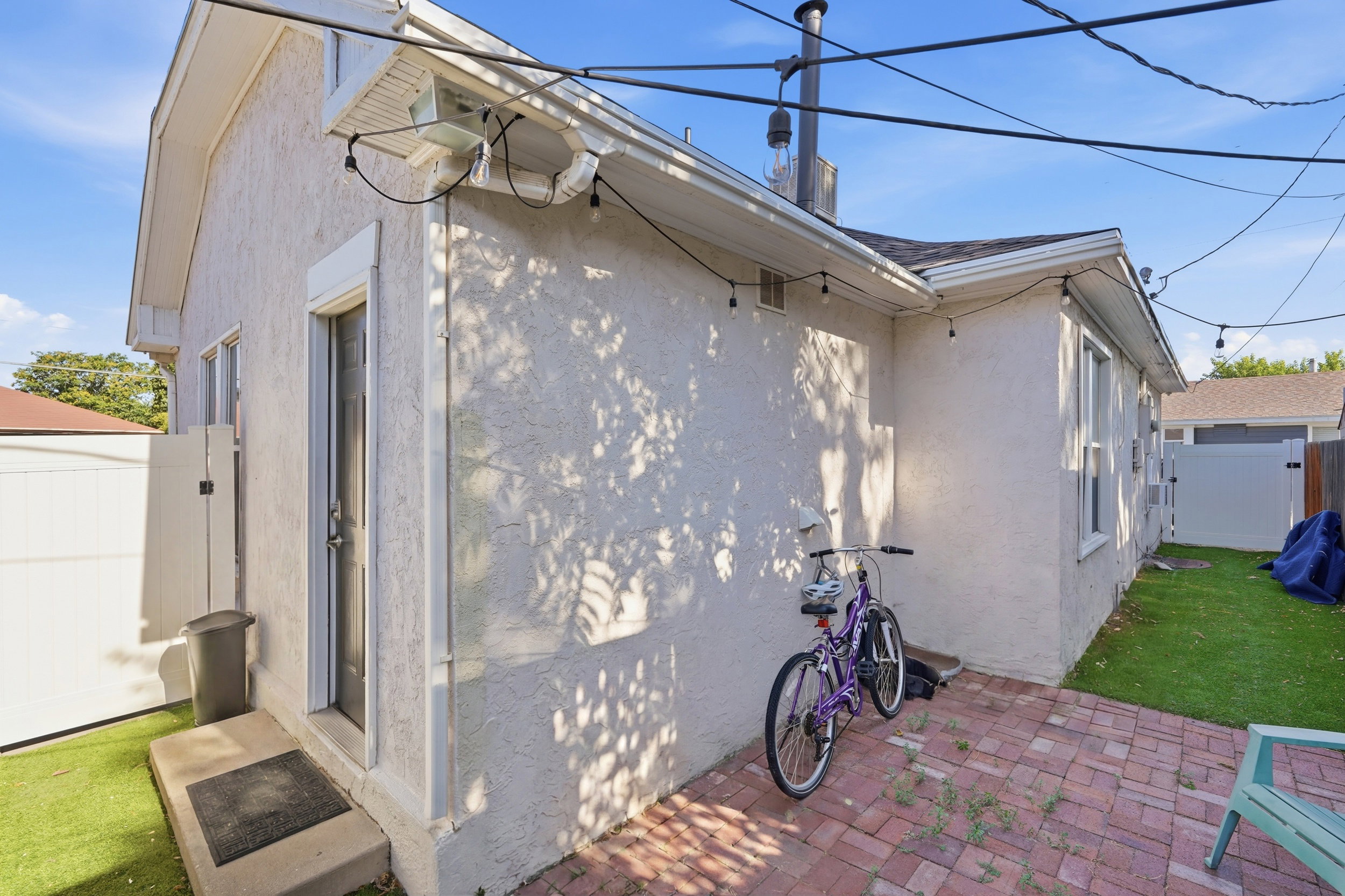 Exterior with stucco finish and a shingle roof