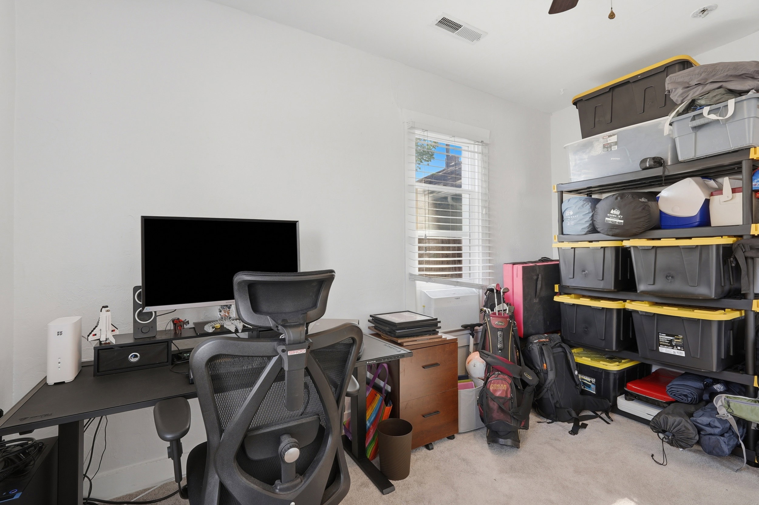 Bright room with light-colored carpeting and white walls