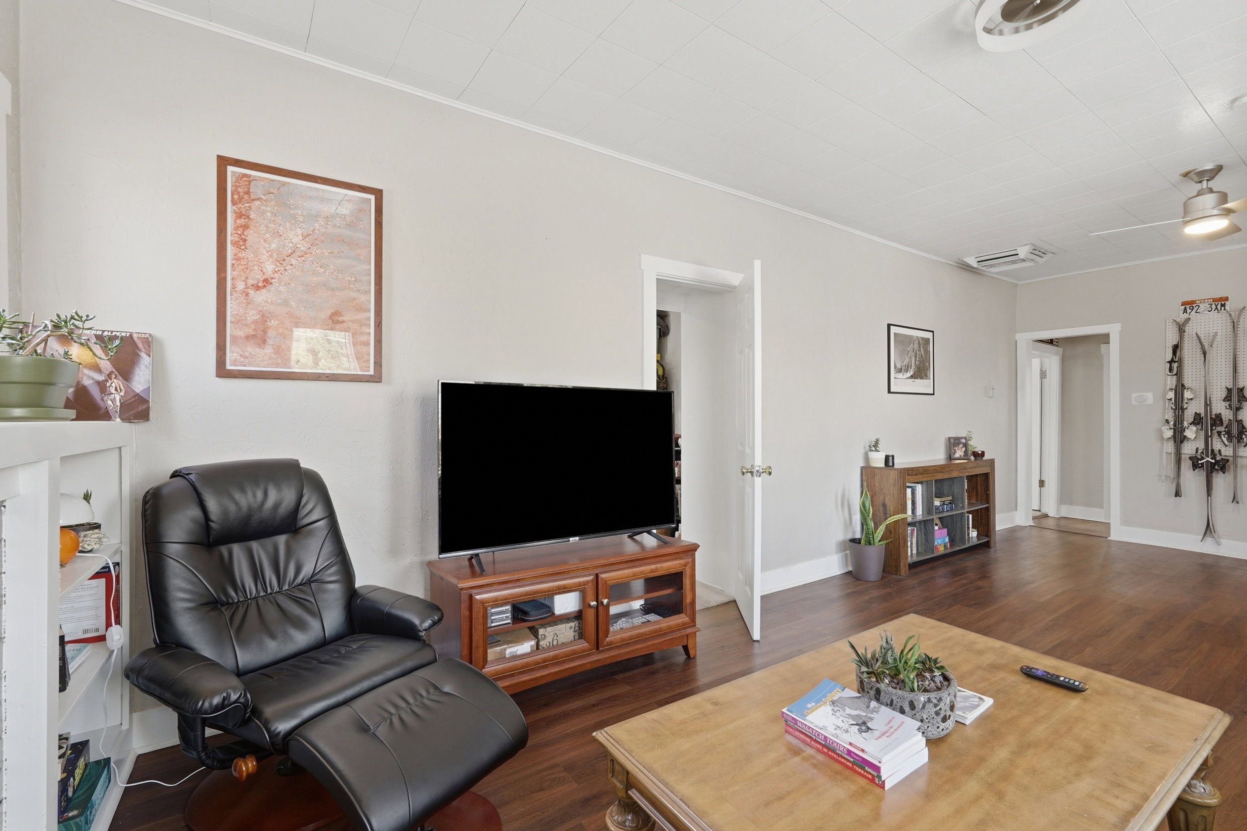 Open concept living space featuring wood-finish flooring and light-toned wall paint