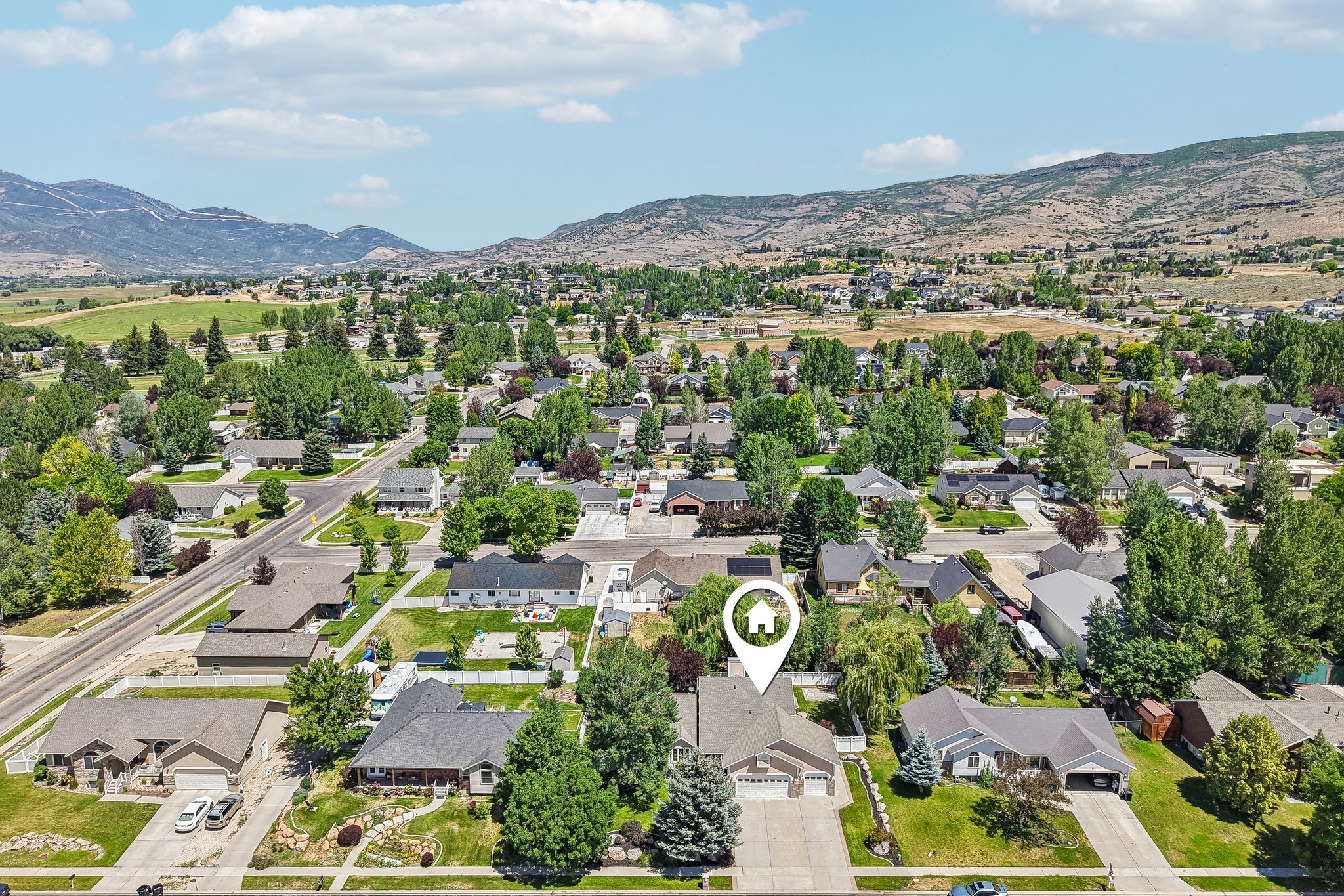 Aerial perspective showcasing a residential neighborhood with varied home styles and mature landscaping