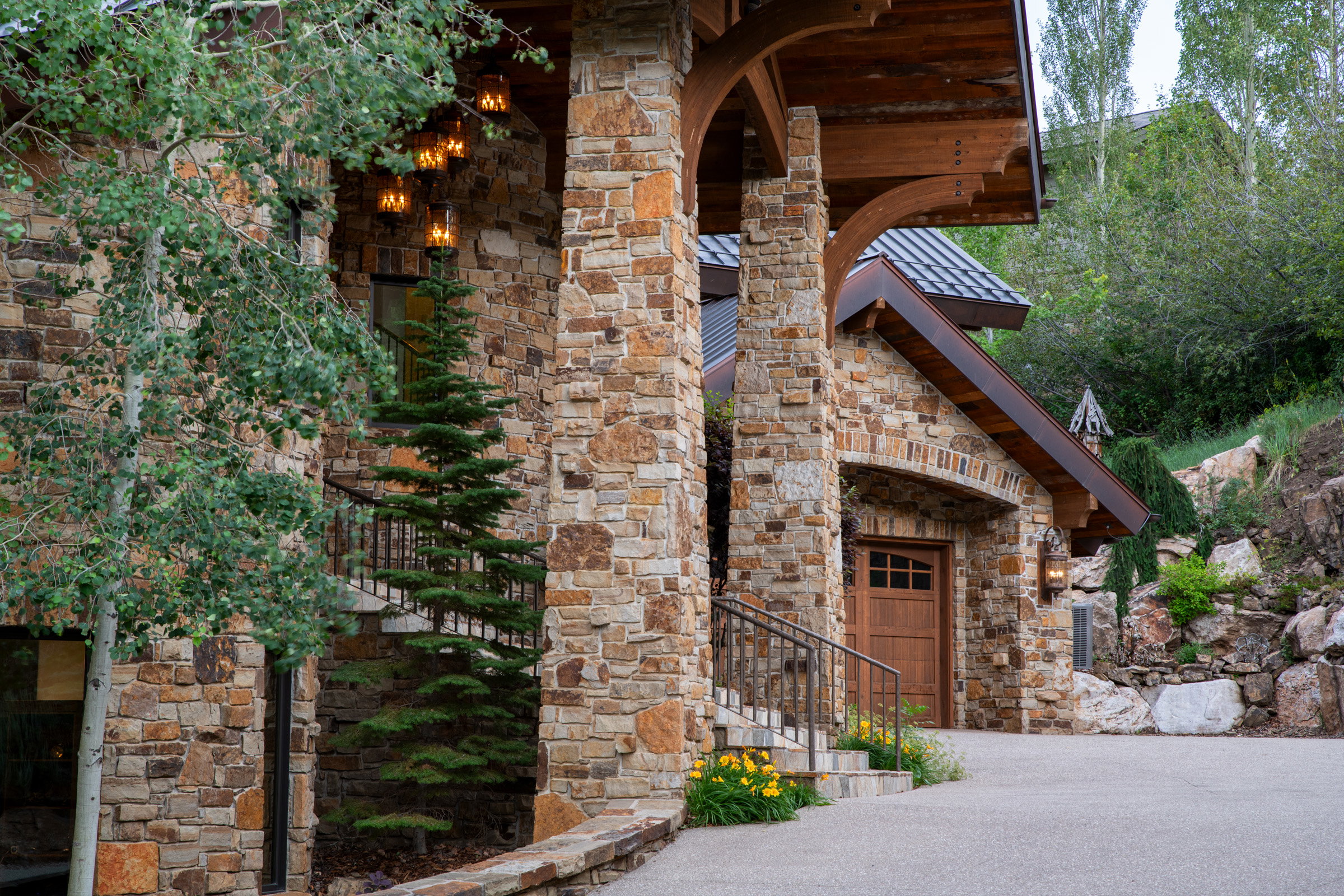 Stone exterior with exposed wood beam accents