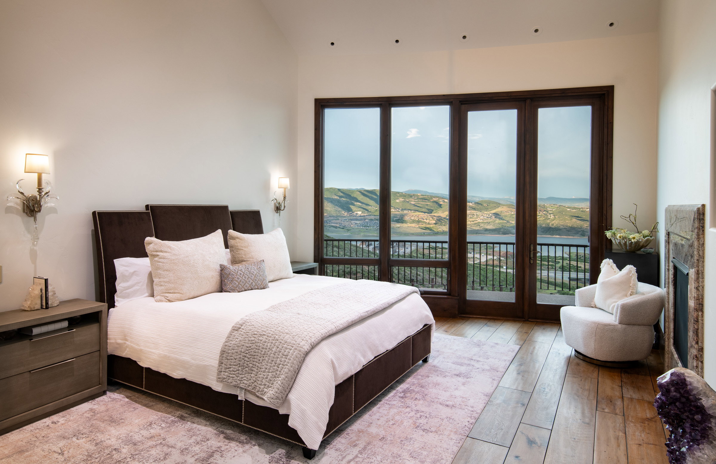 Wood-finish flooring throughout, featuring a built-in fireplace with a stone surround