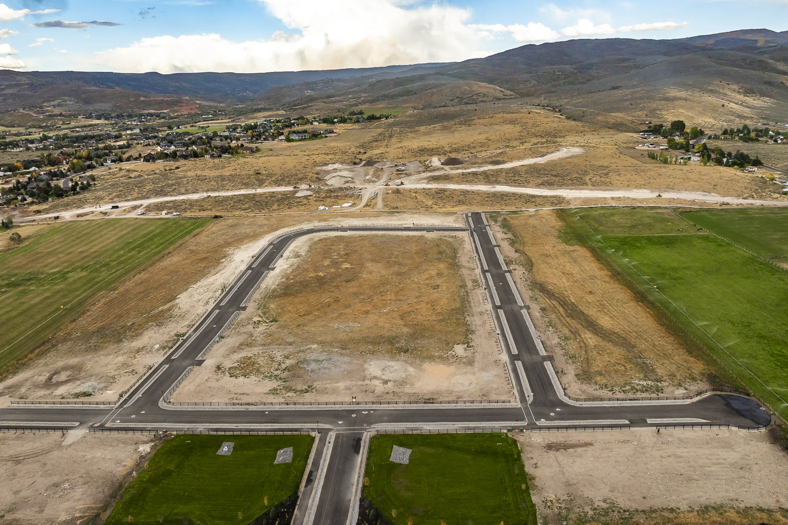 Developed land featuring newly paved roads and infrastructure