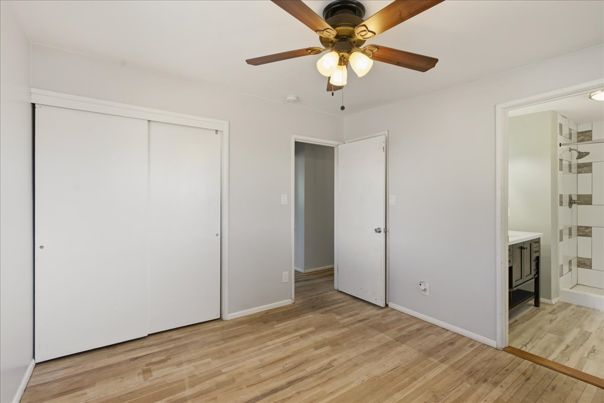 Wood-finish flooring throughout, complemented by light gray walls