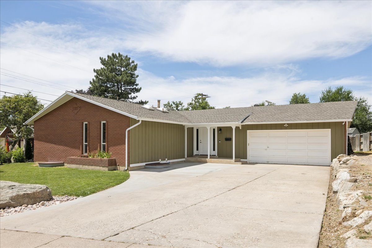 Ranch-style exterior with a combination of brick and vertical siding