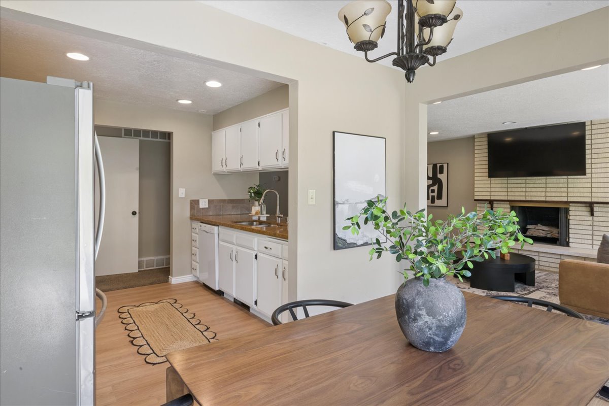 Dining area featuring a wood-finish table and an ornamental chandelier