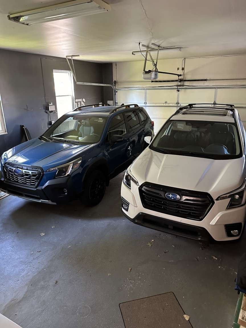 Two-car garage featuring a concrete floor and a white panel garage door
