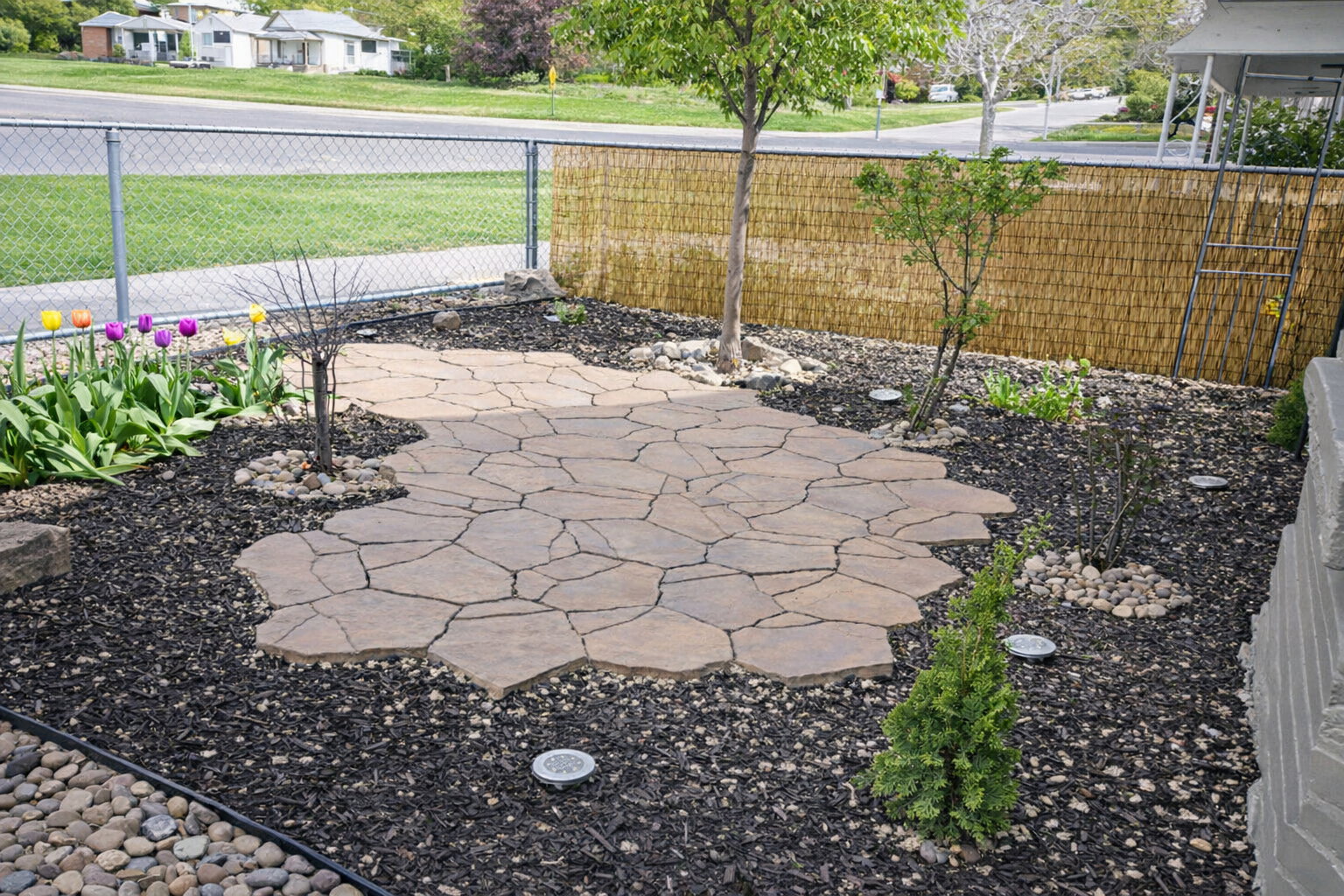 Front garden with mulch, gravel and pavers.