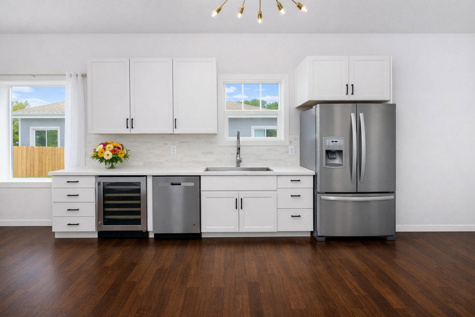 Under counter wine cooler matches stainless steel appliances.