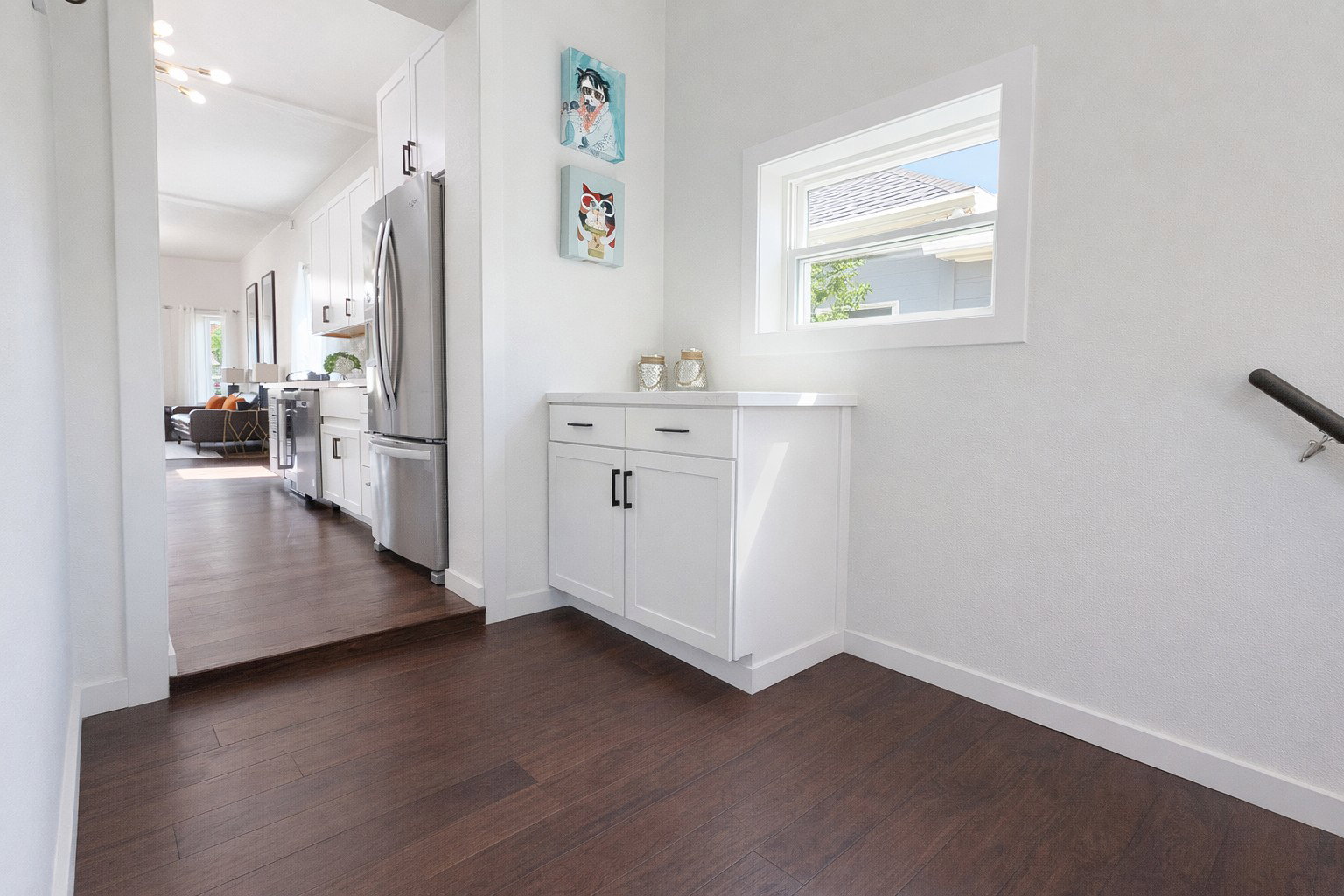 Storage cabinet with quartz countertop in main floor laundry.