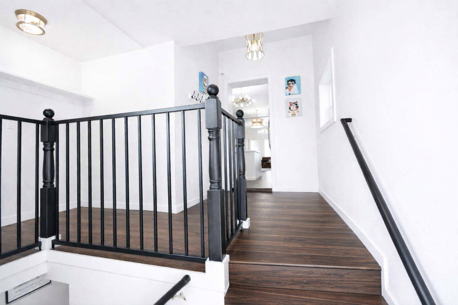 Spacious stair landing on main floor with main floor laundry.