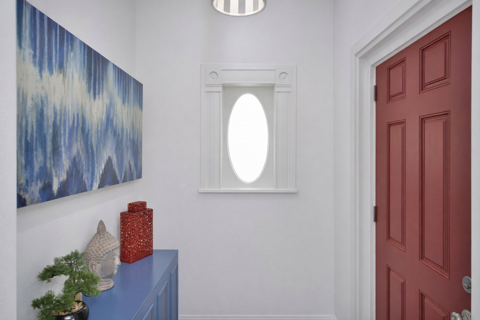 Nostalgic oval window in foyer.