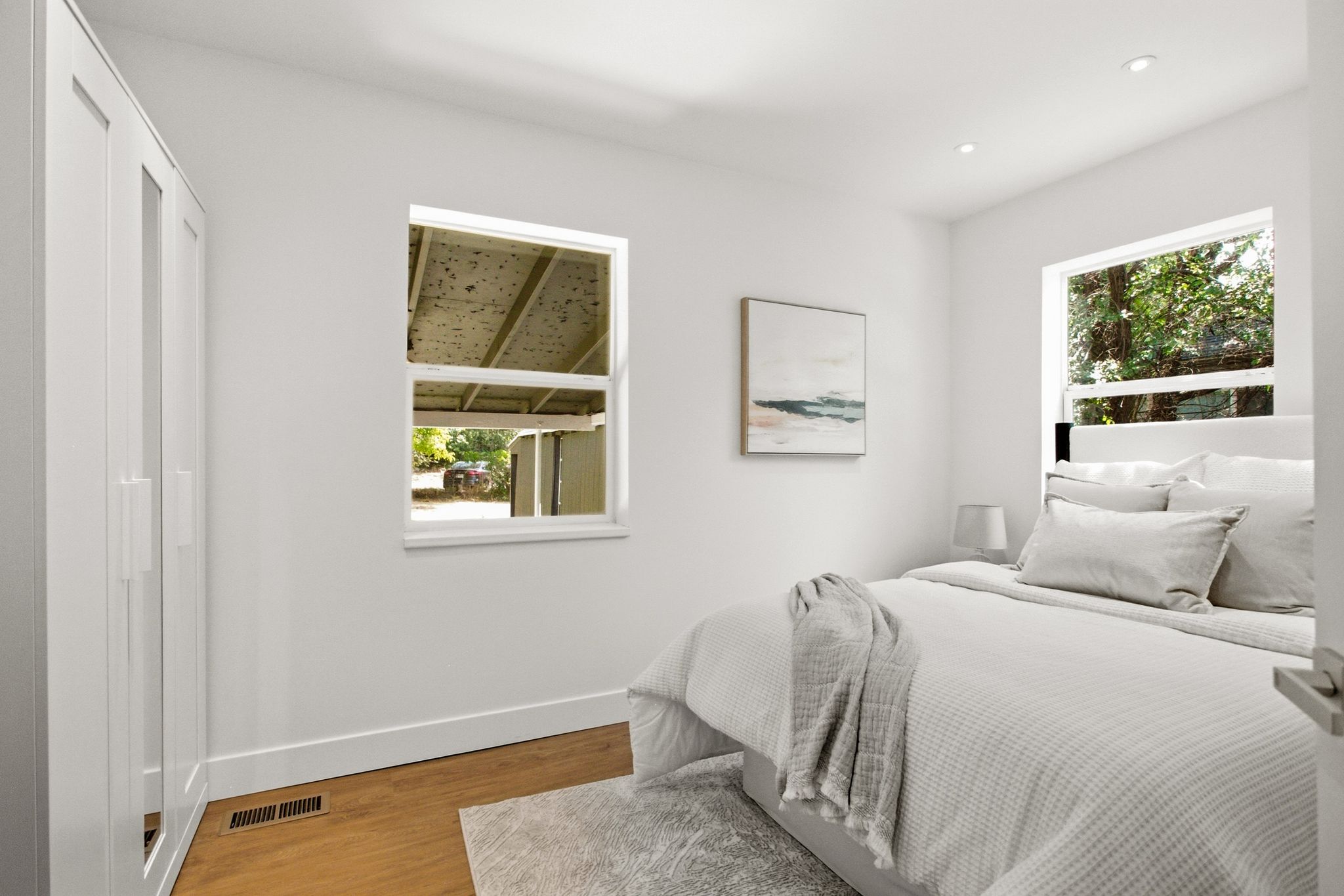 Bedroom featuring wood-finish flooring, recessed lighting, and white trim