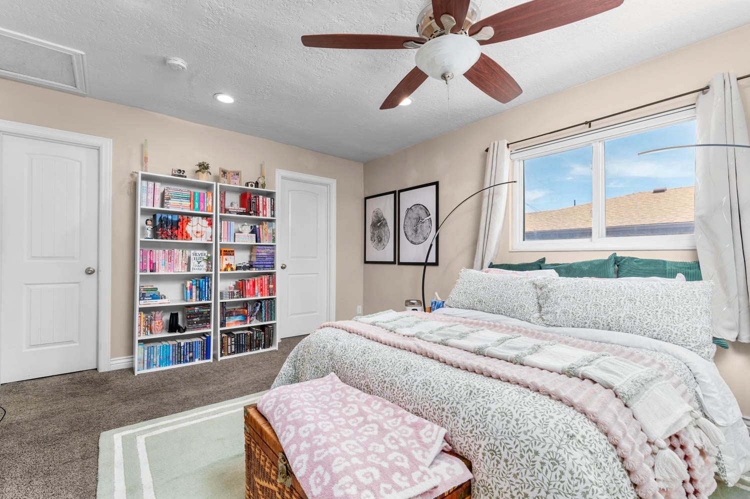 Bedroom featuring a dual-pane window, ceiling fan with integrated lighting, recessed lighting, and soft neutral wall tones