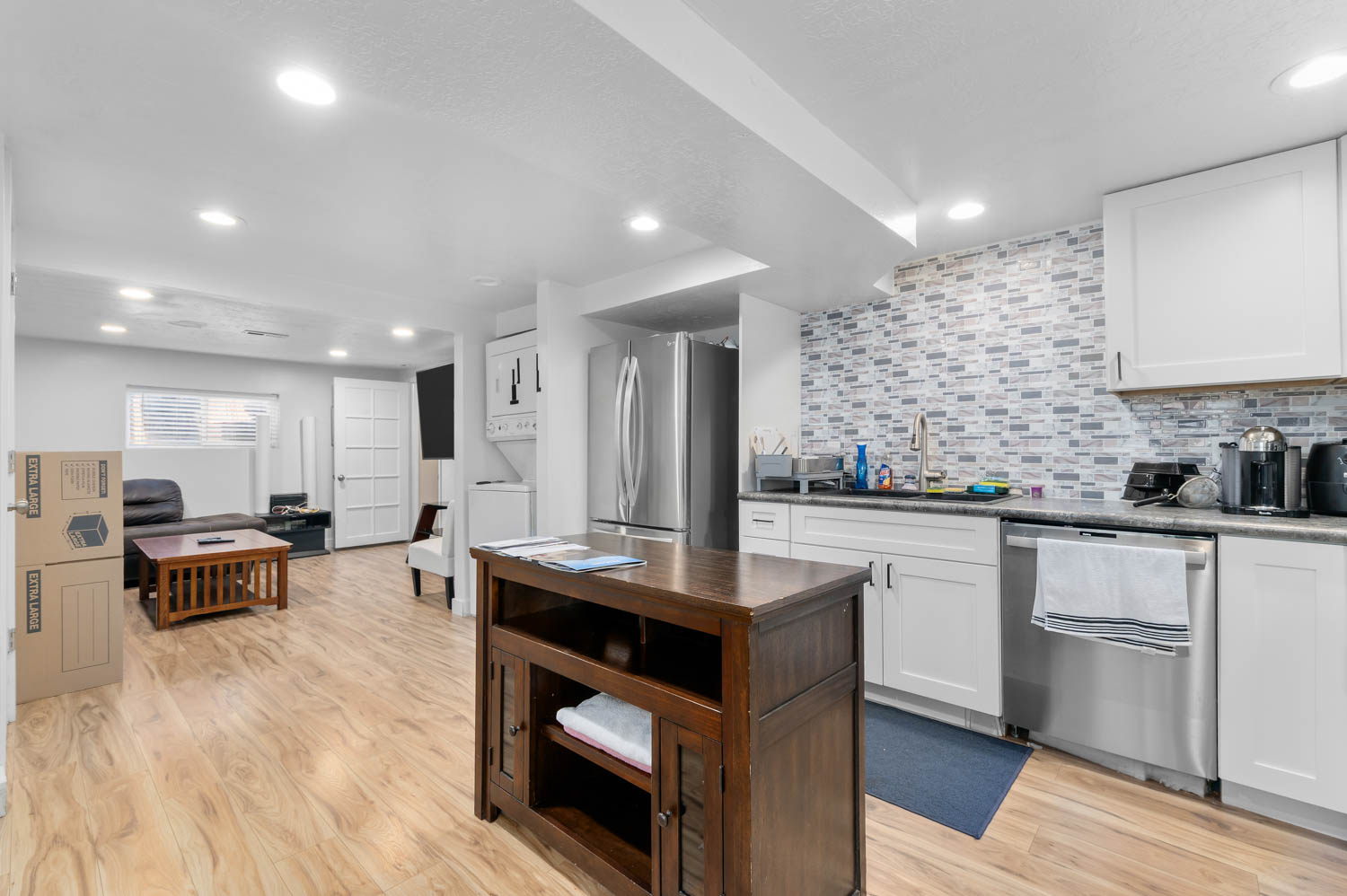 Open concept living area featuring wood-finish flooring