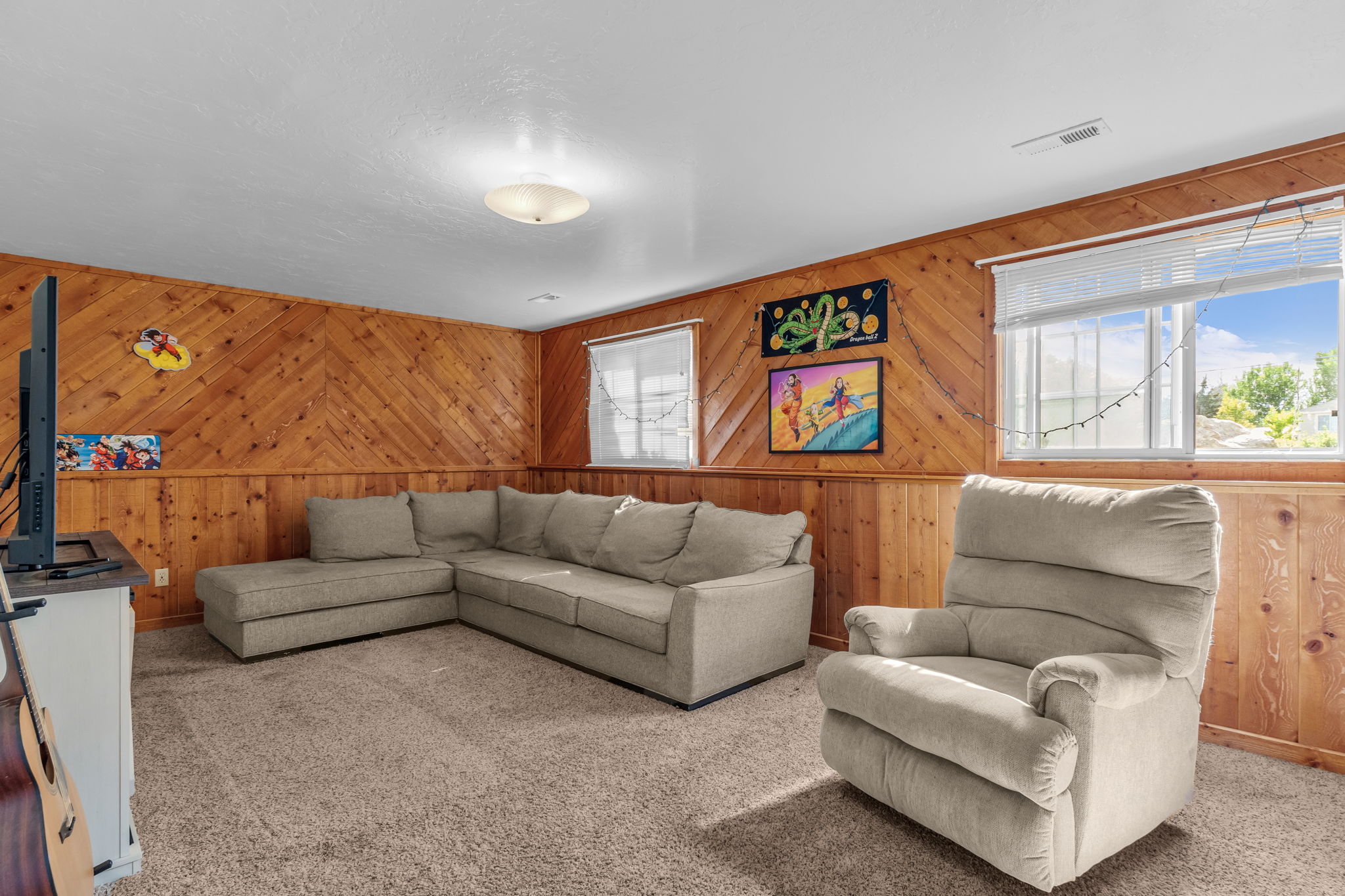 Finished interior space with wood paneling and wainscoting