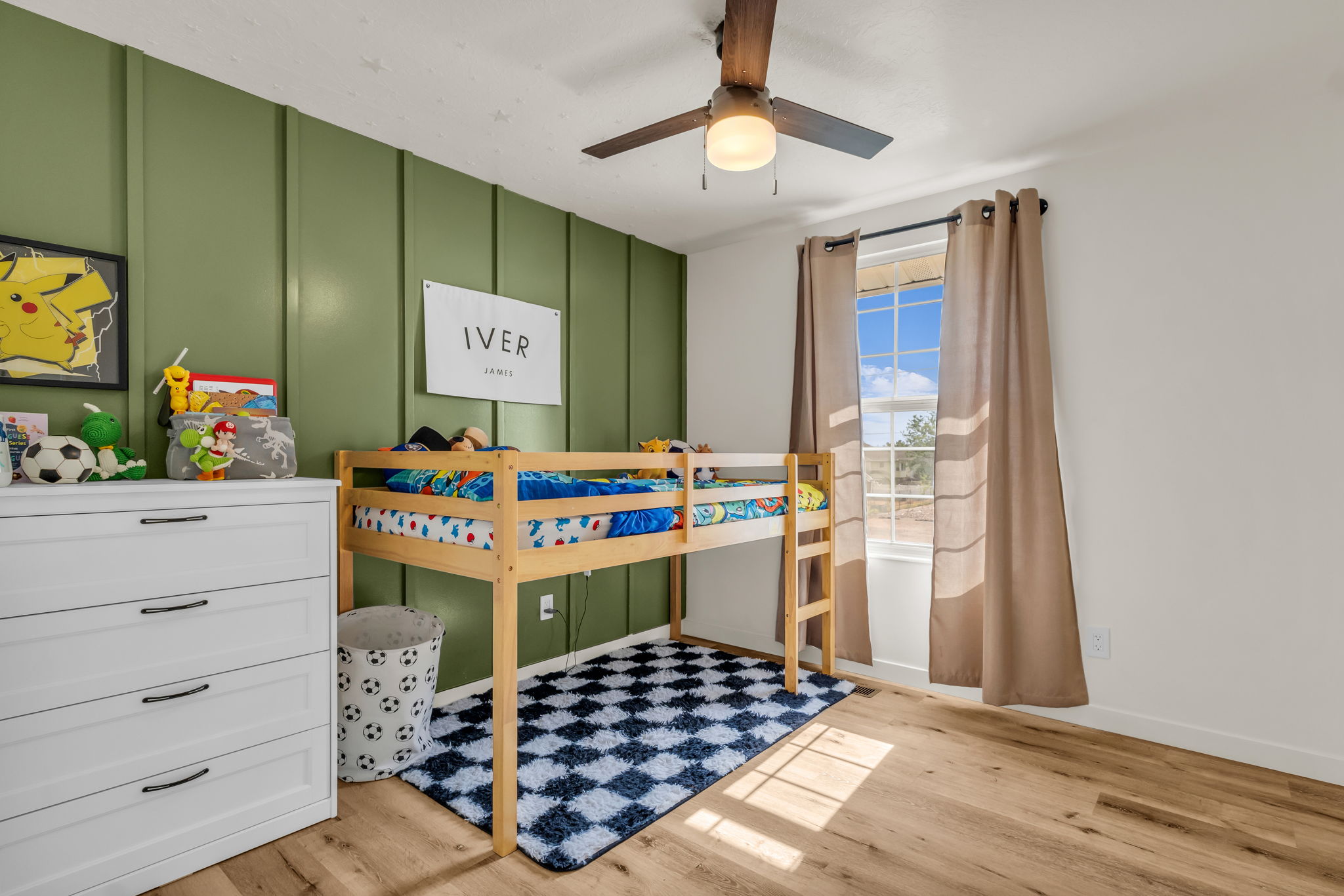 Light wood-finish flooring complements the room's design