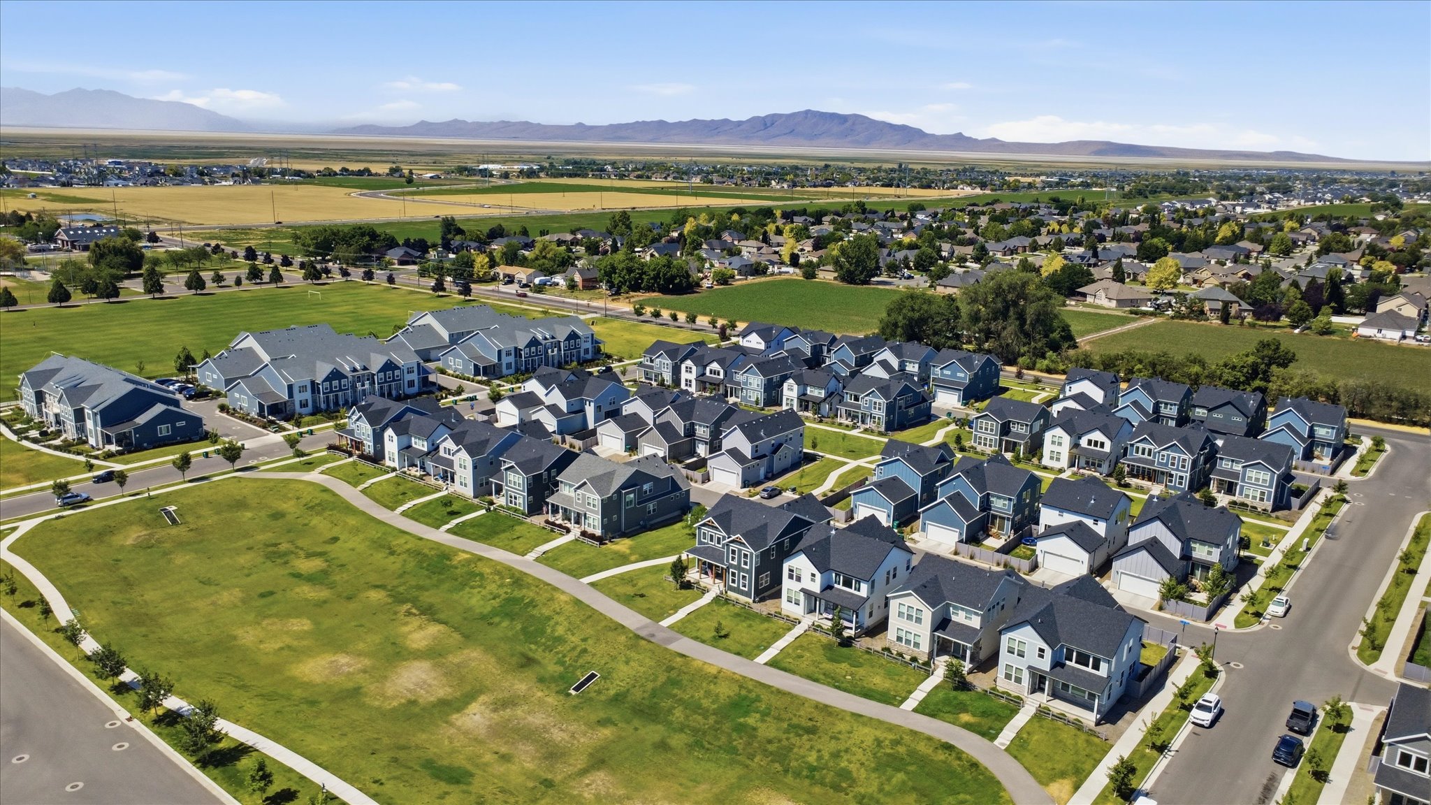 Newly constructed homes featuring diverse architectural styles and attached garages