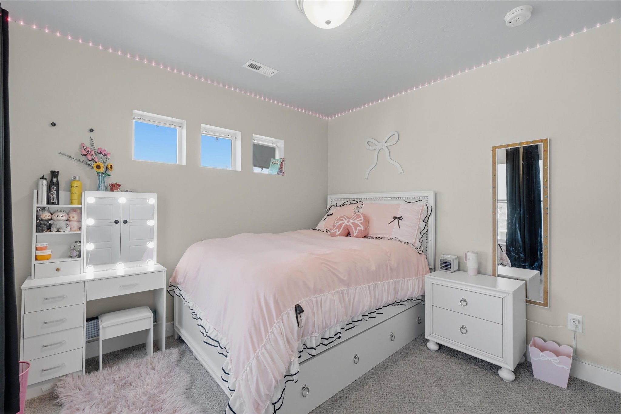 White headboard and bed frame with integrated storage drawers