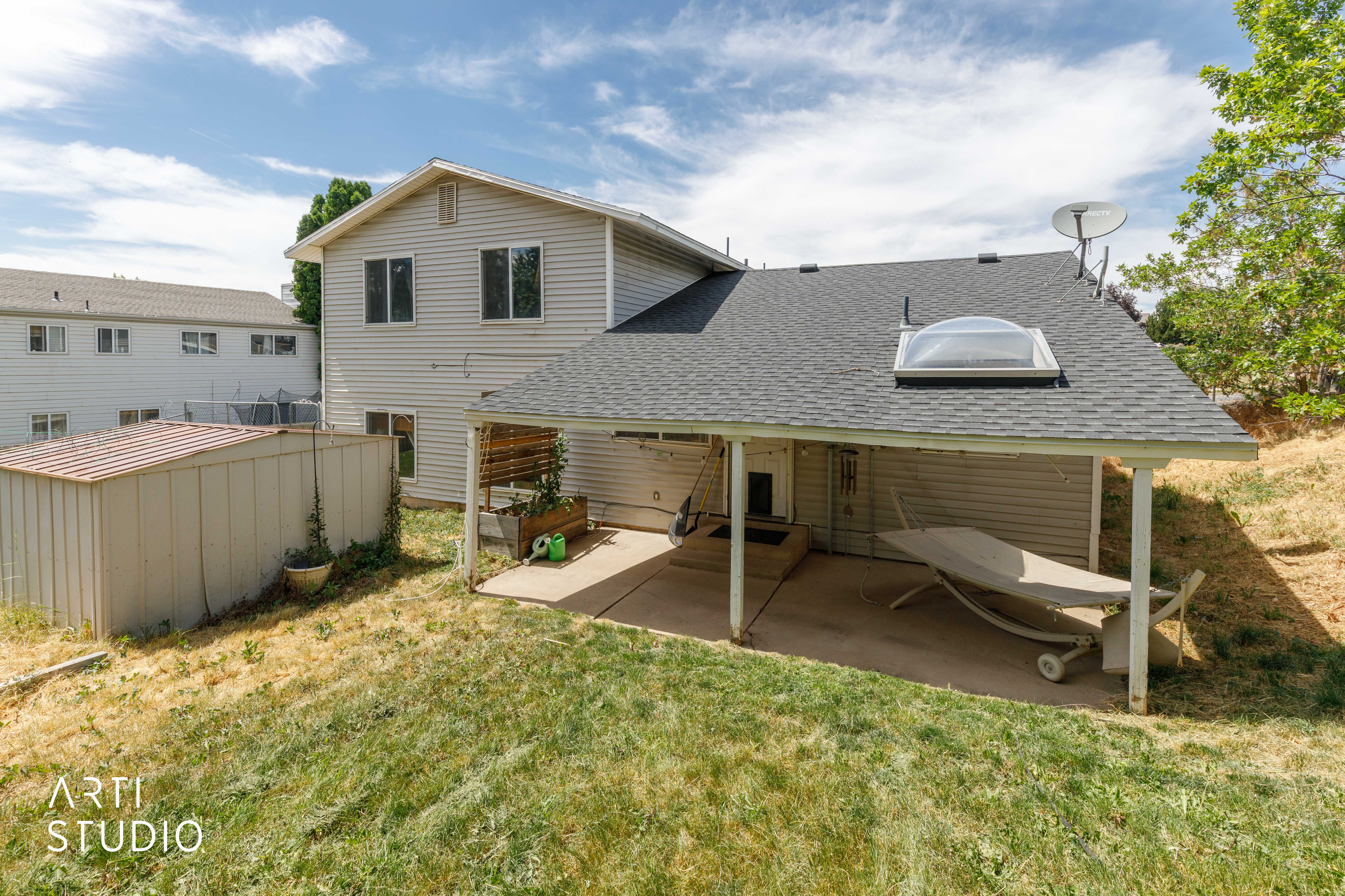 Covered patio with concrete flooring, skylight, and direct exterior access