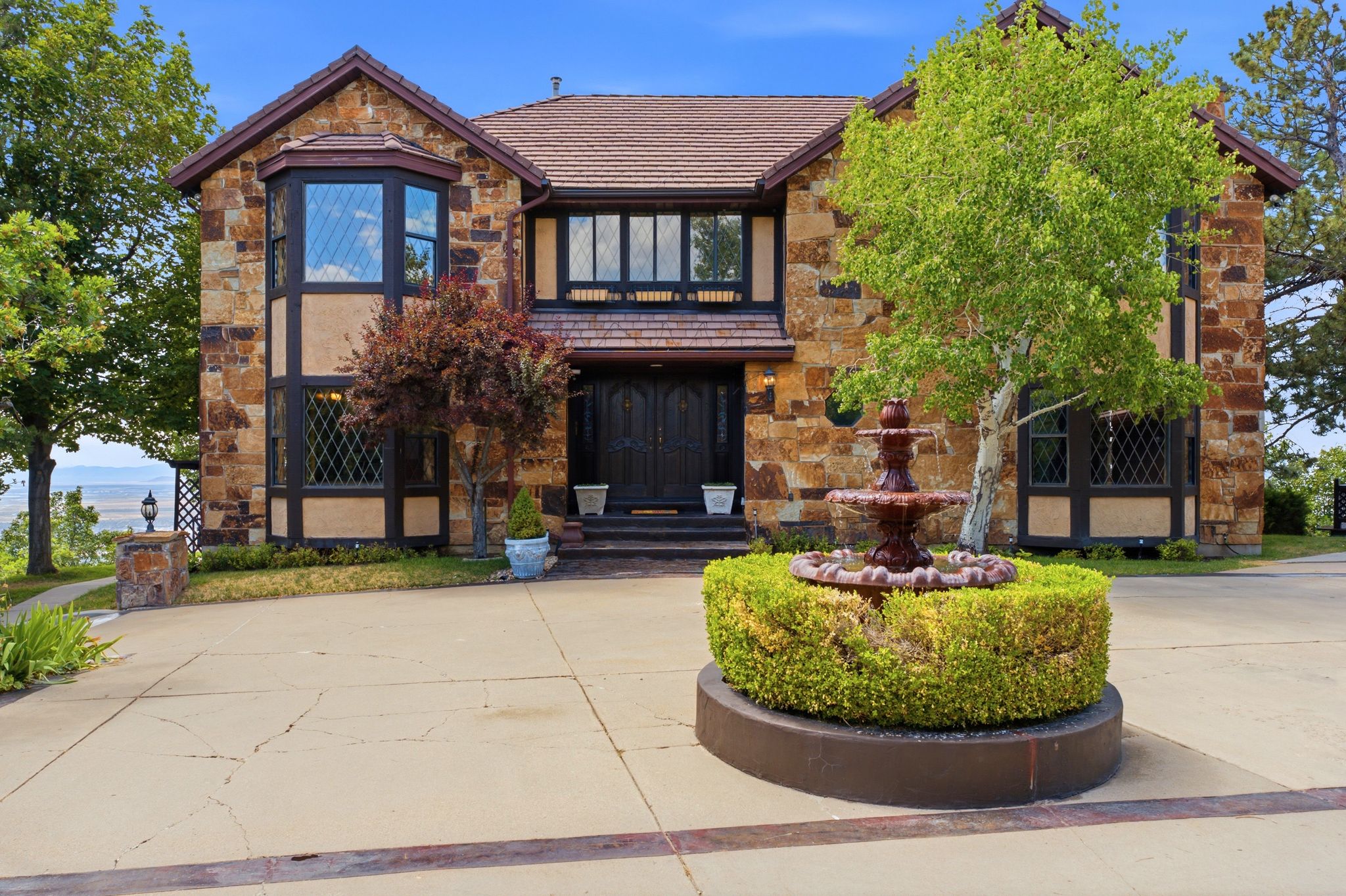 Front approach with circular driveway with fountain