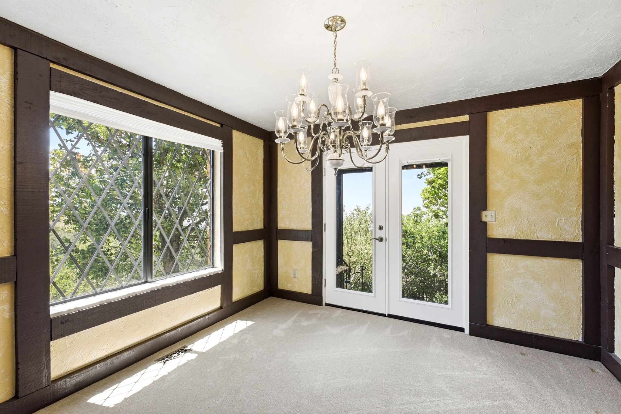 Dining room off kitchen with doorway out to back patio