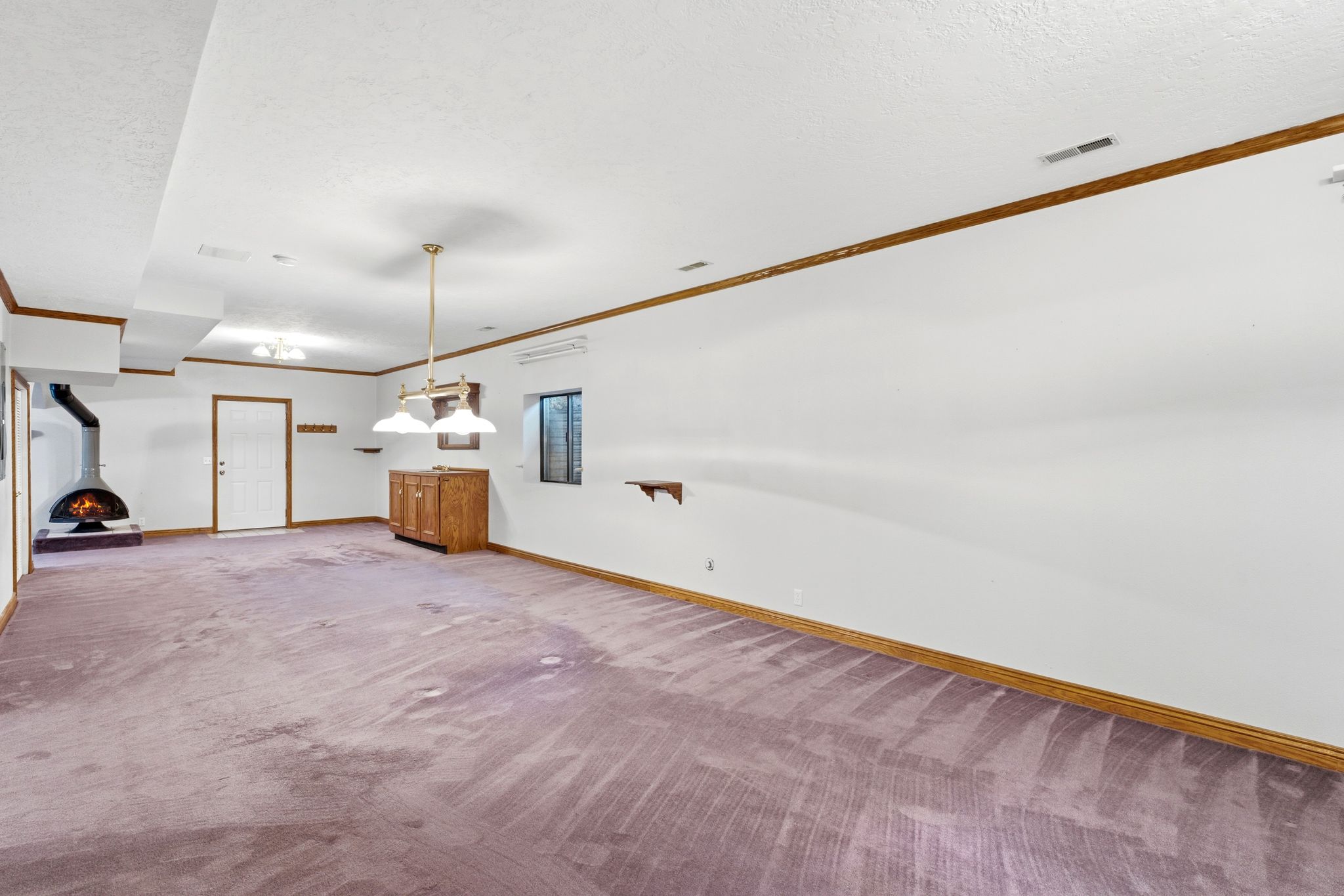 Lower level family room showing walk-out to backyard