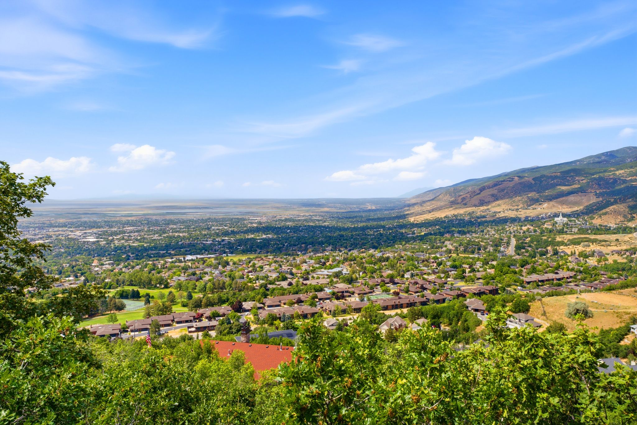 Elevated perspective showcasing expansive valley and distant mountain ranges