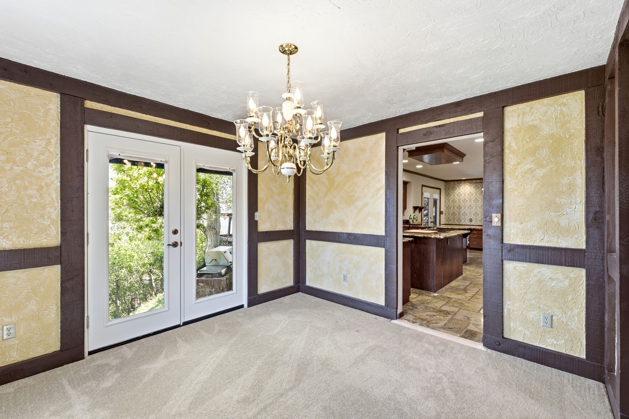 Formal dining room showing access to the kitchen and walks out to back patio