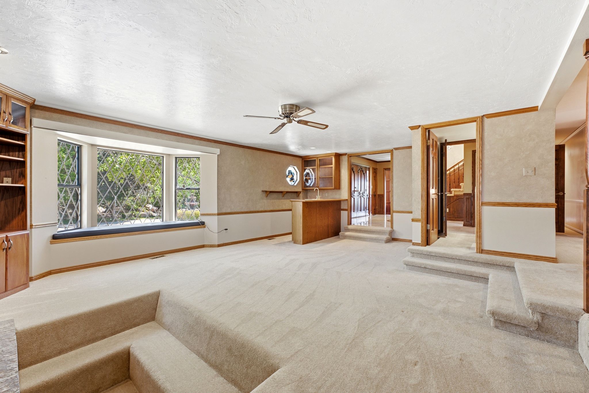 Main level family room with bay window and wetbar