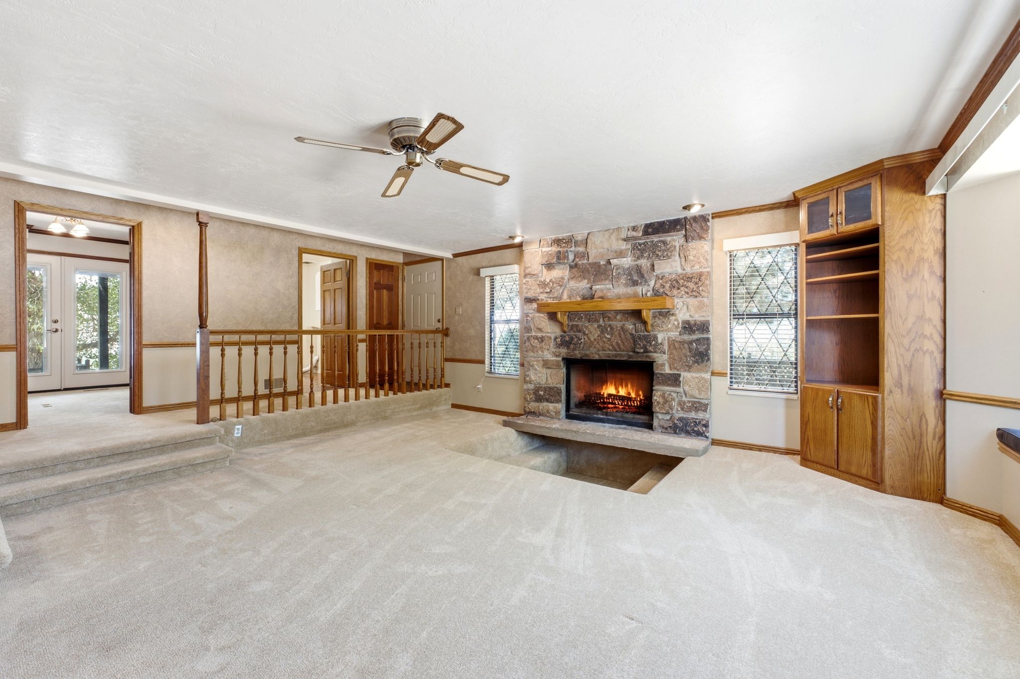 Main level family room showing access to office and laundry room