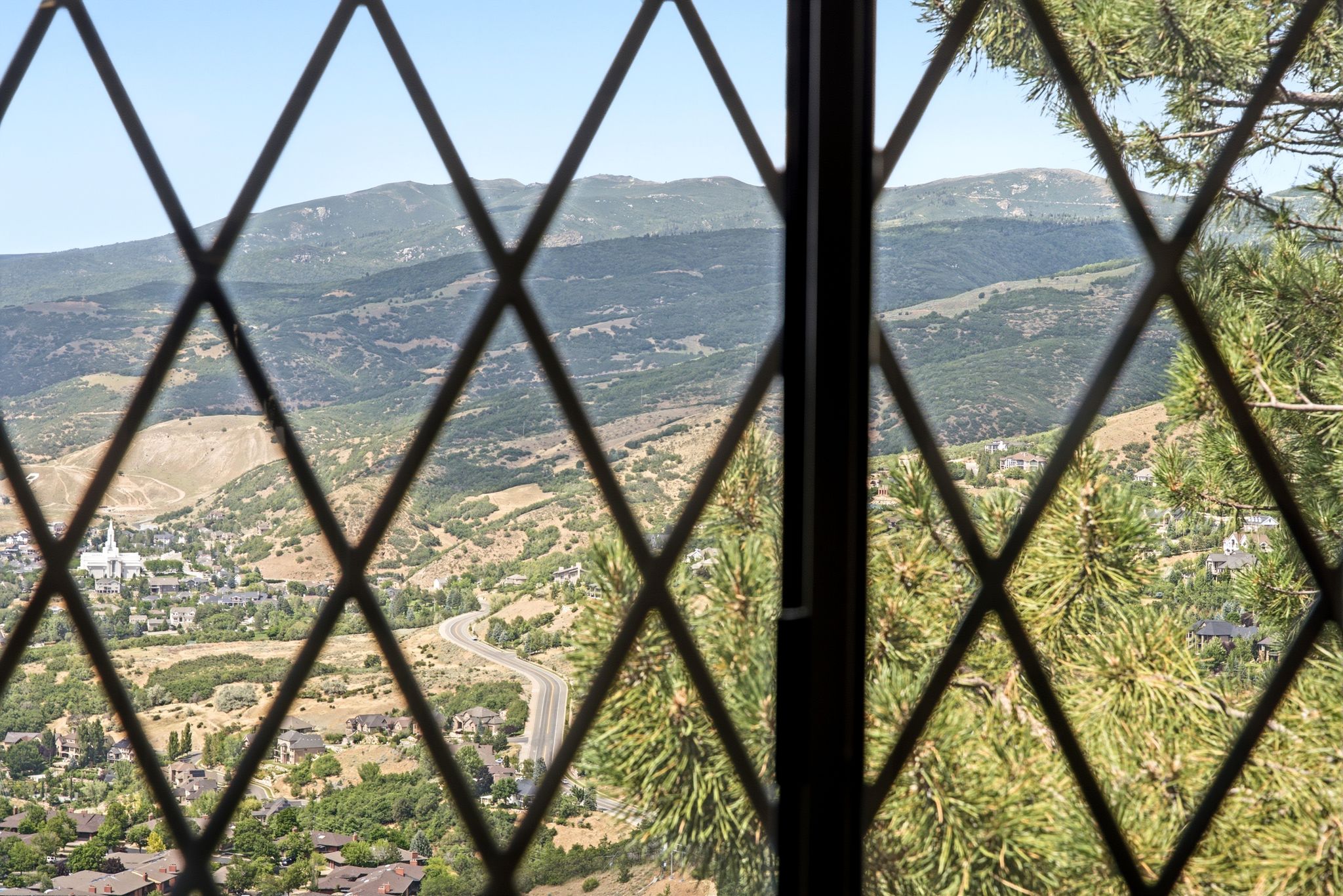 Leaded glass window offering expansive mountain and valley vistas