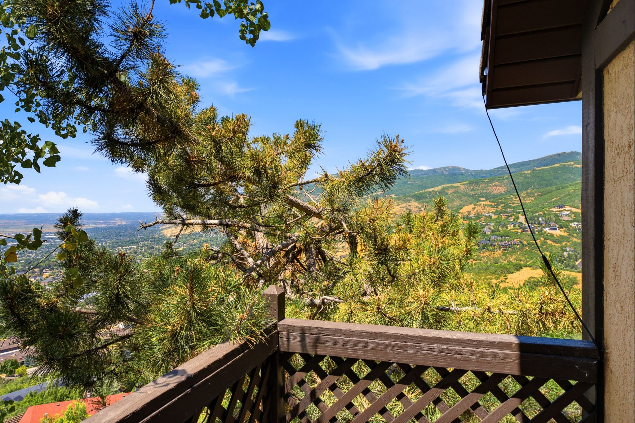 Balcony view from primary suite of valley and mountain scenery