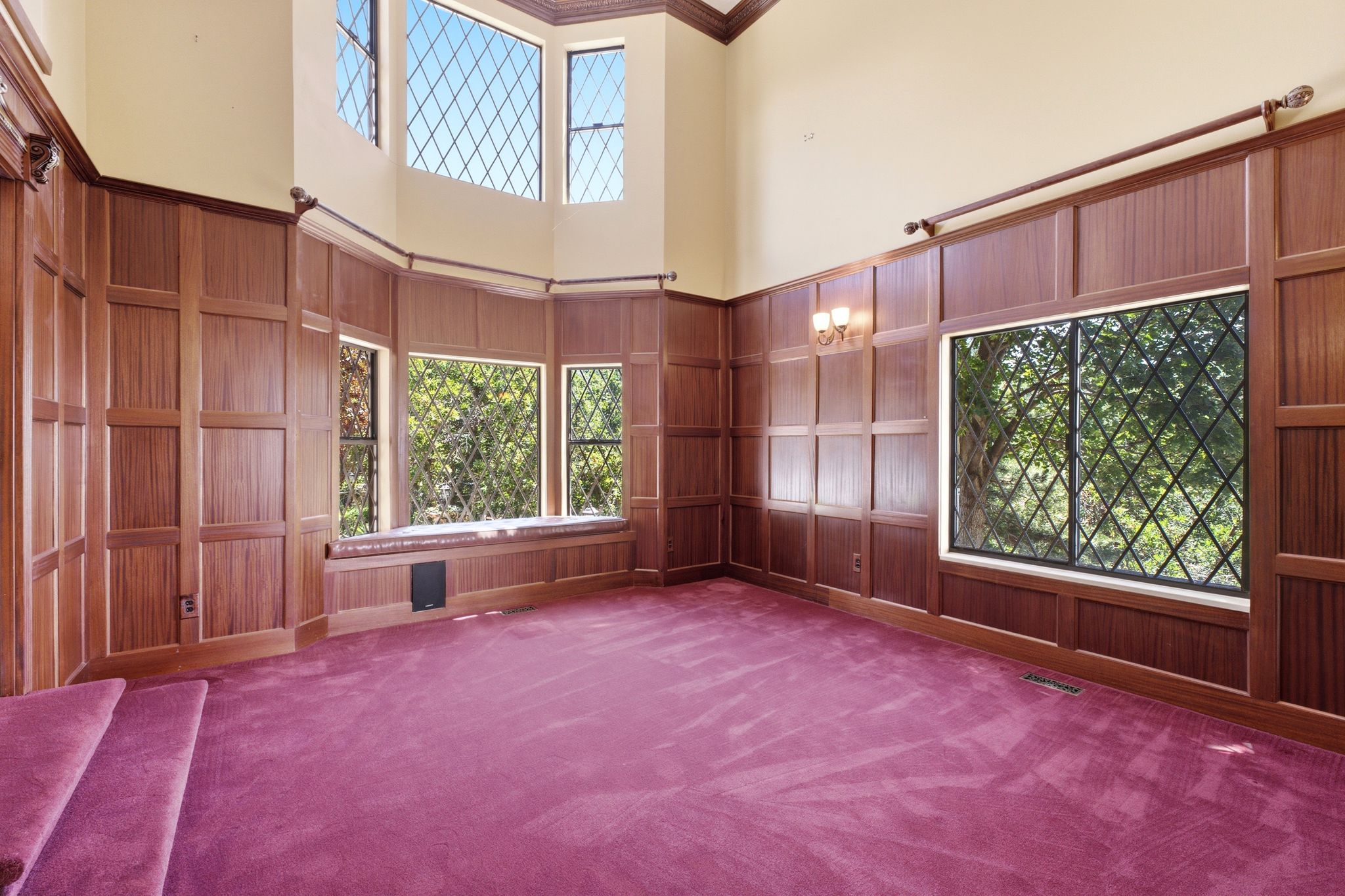 Living room featuring high ceilings and custom millwork