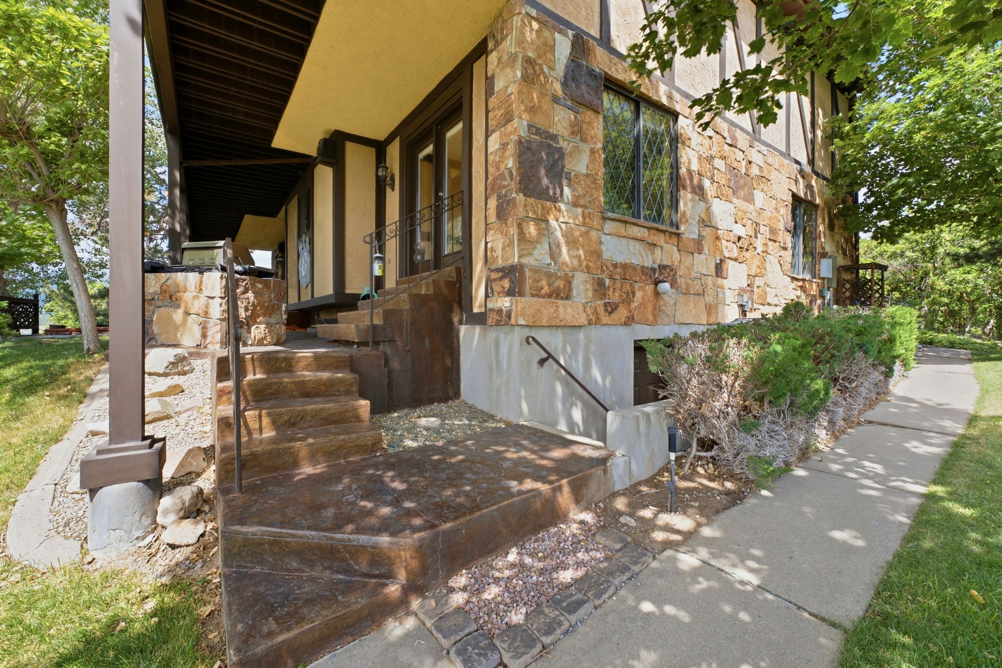 View of back patio and side of home