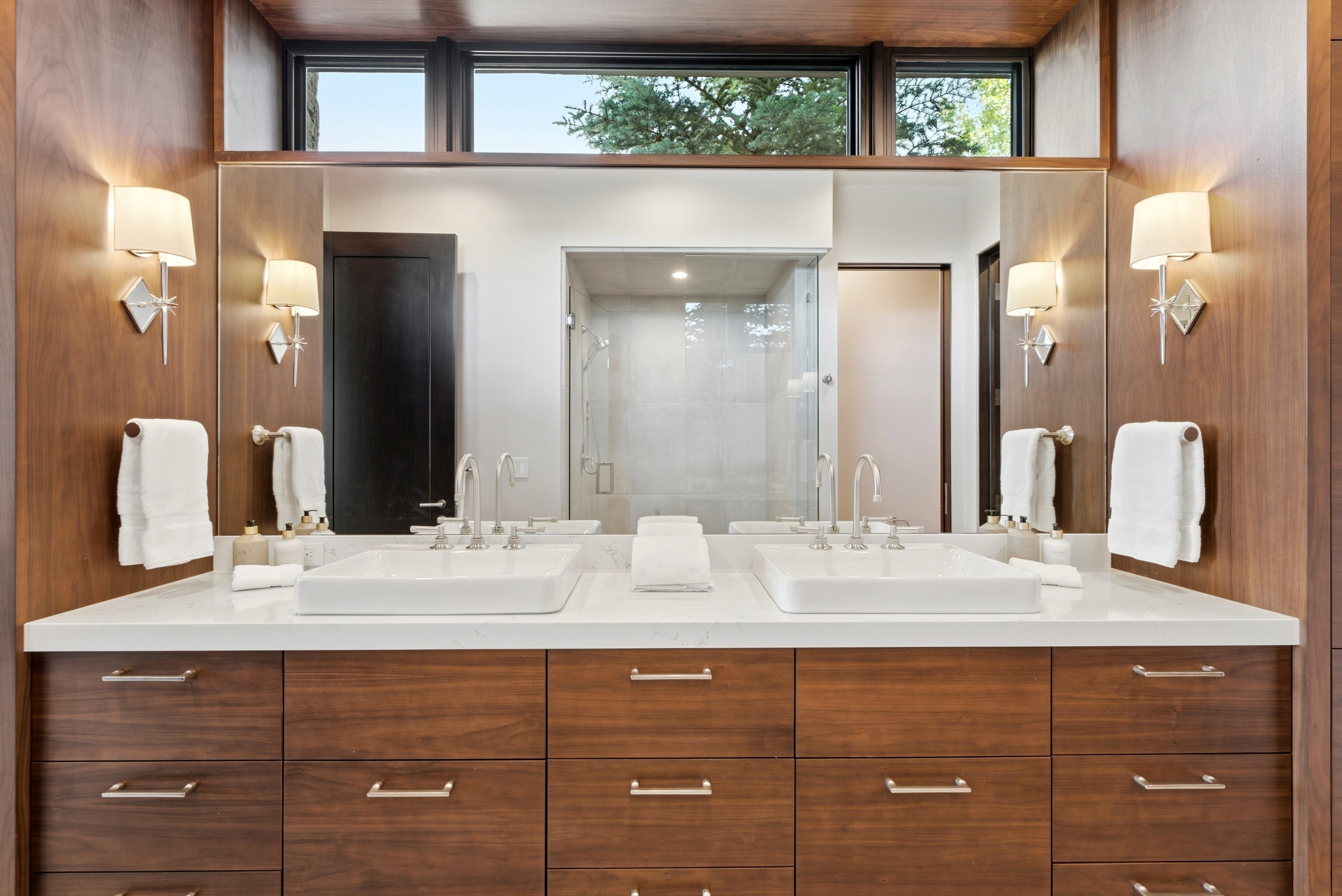 Dual vanity with wood-finish cabinetry and rectangular vessel sinks