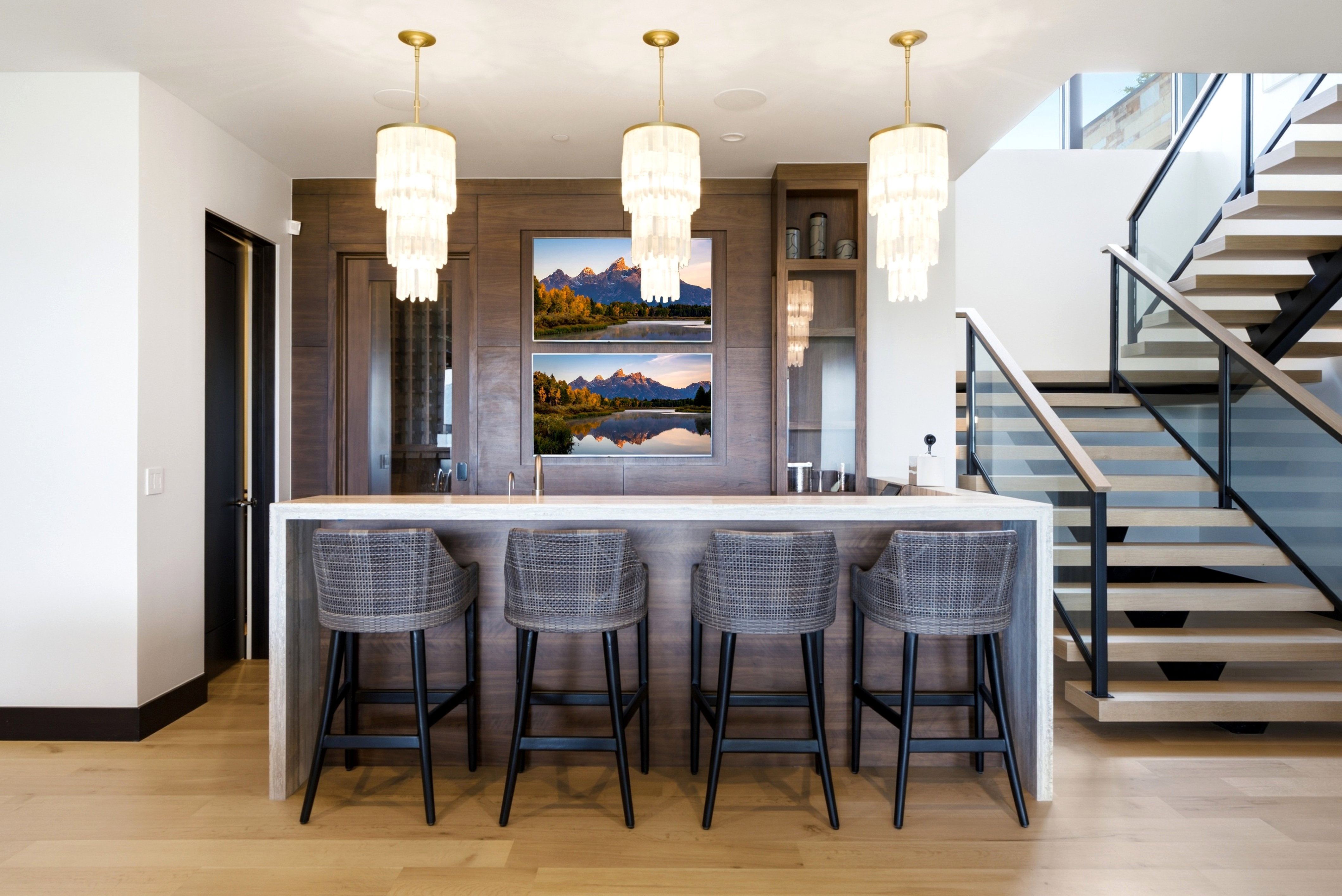 Built-in bar area featuring a light-toned countertop and wood-finish paneling