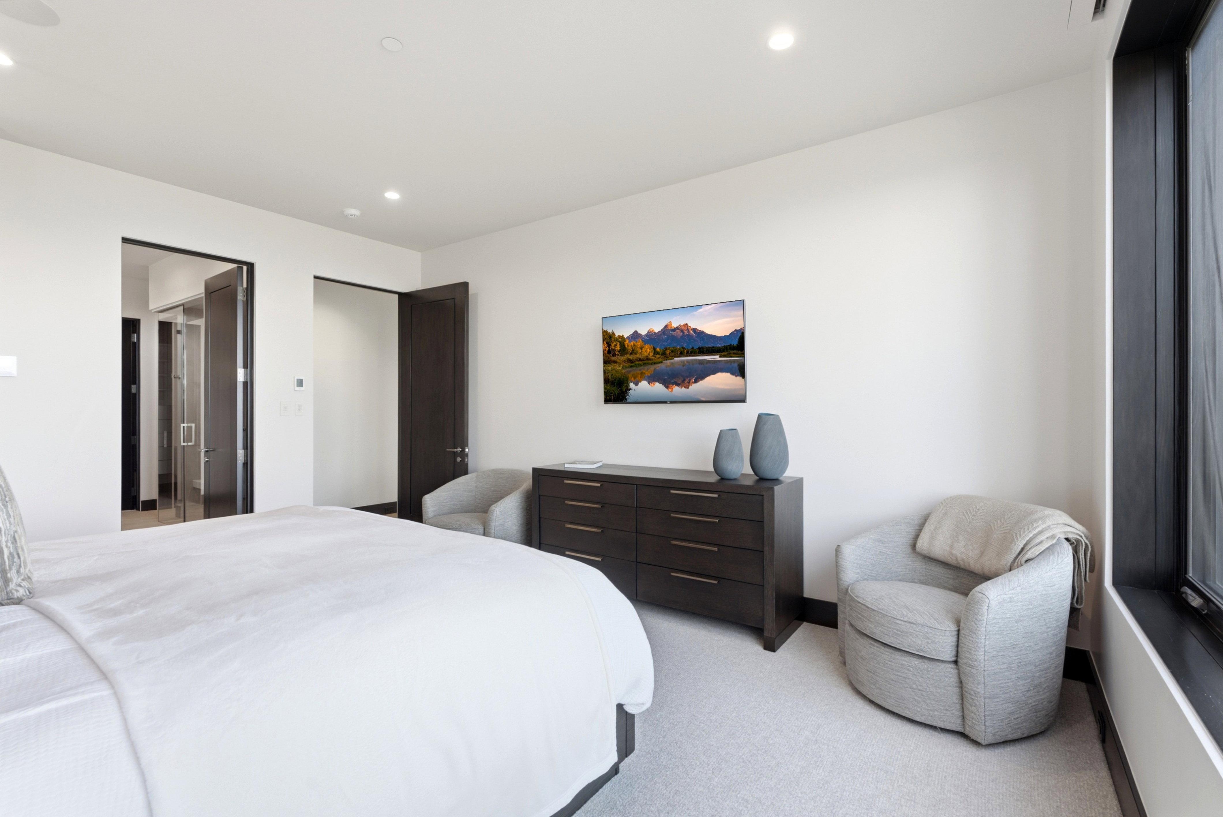Interior space featuring white walls and light-colored carpet