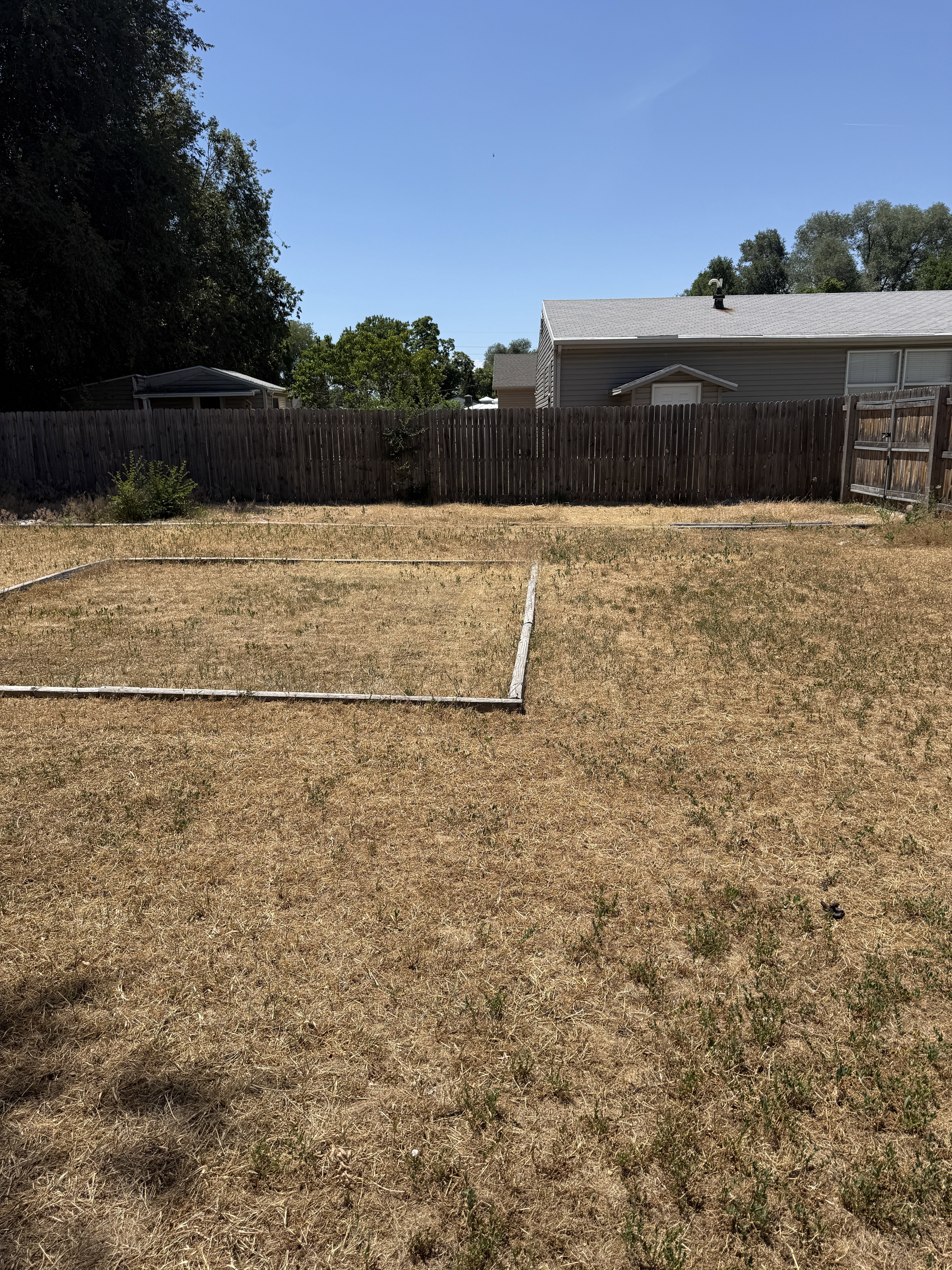 Expansive backyard with RV parking behind that gate