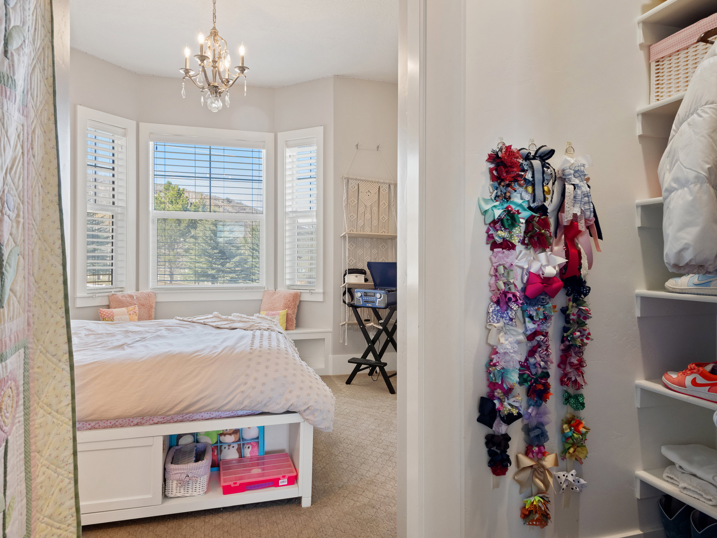Bay window with built-in bench seating and solid white plantation shutters