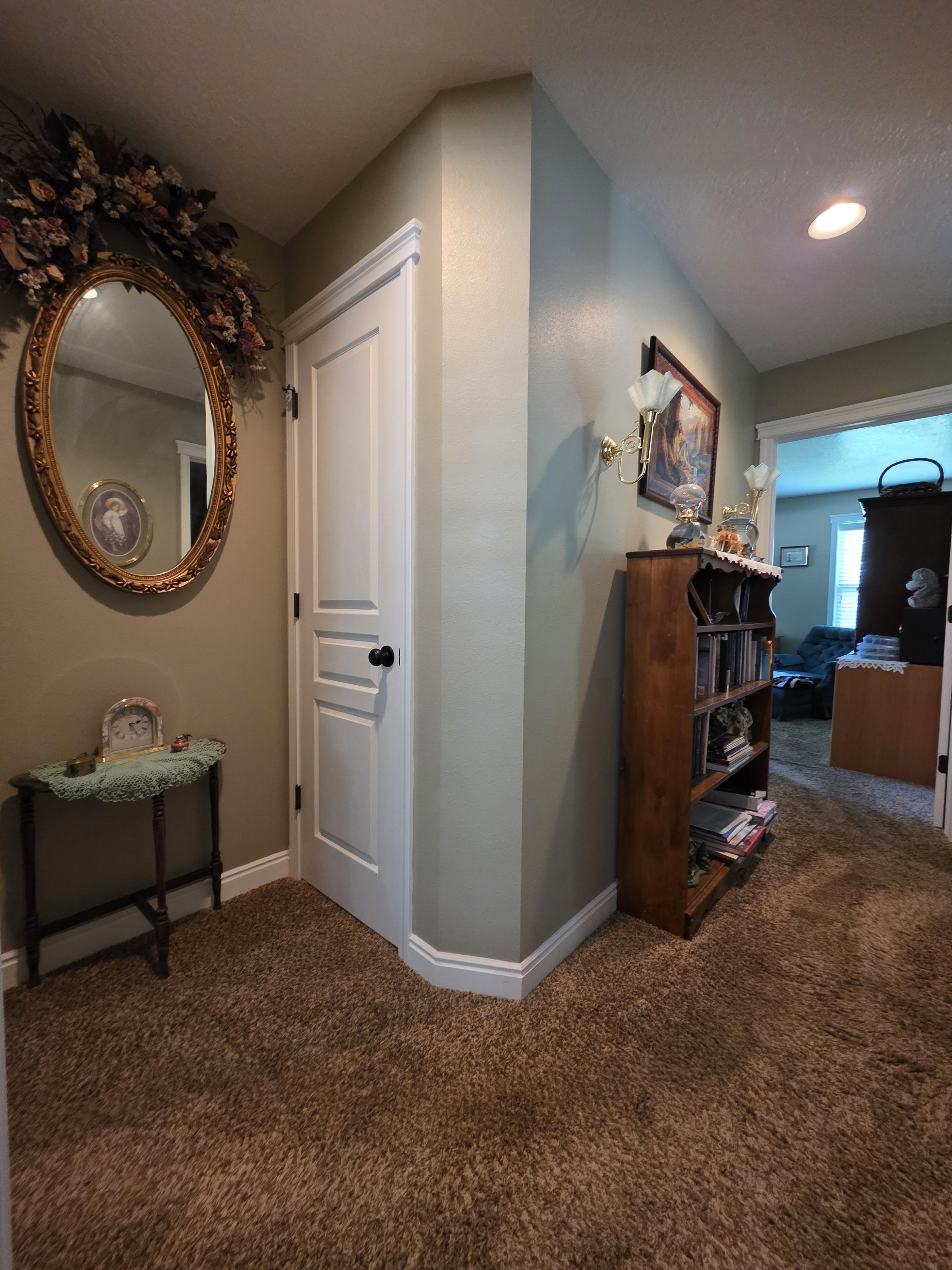 Neutral-toned walls with white baseboards and door trim