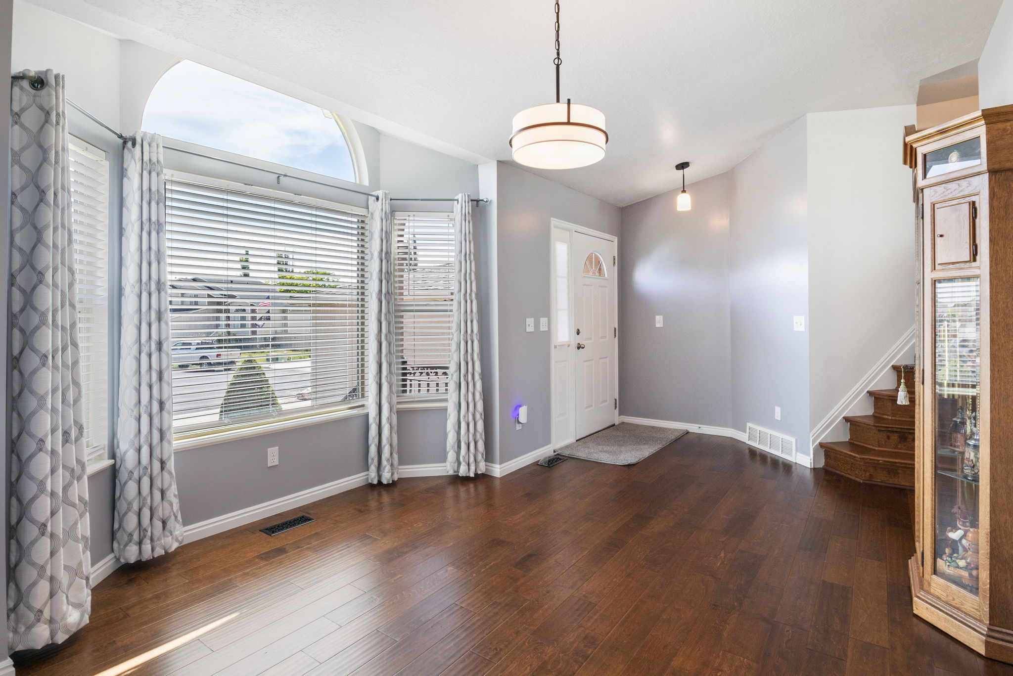 Living area featuring engineered wood flooring and light gray walls