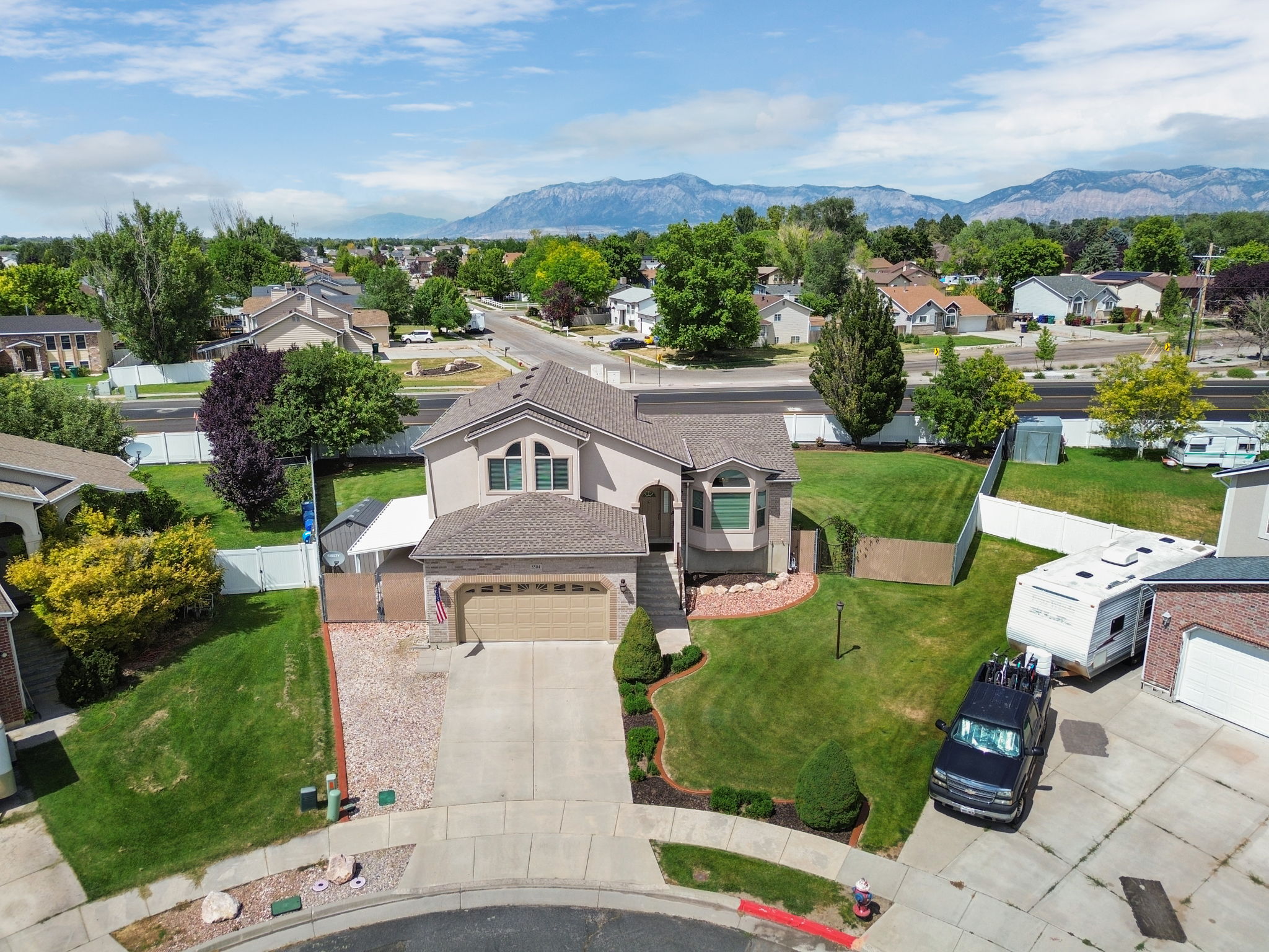 Stucco exterior home with an attached two-car garage