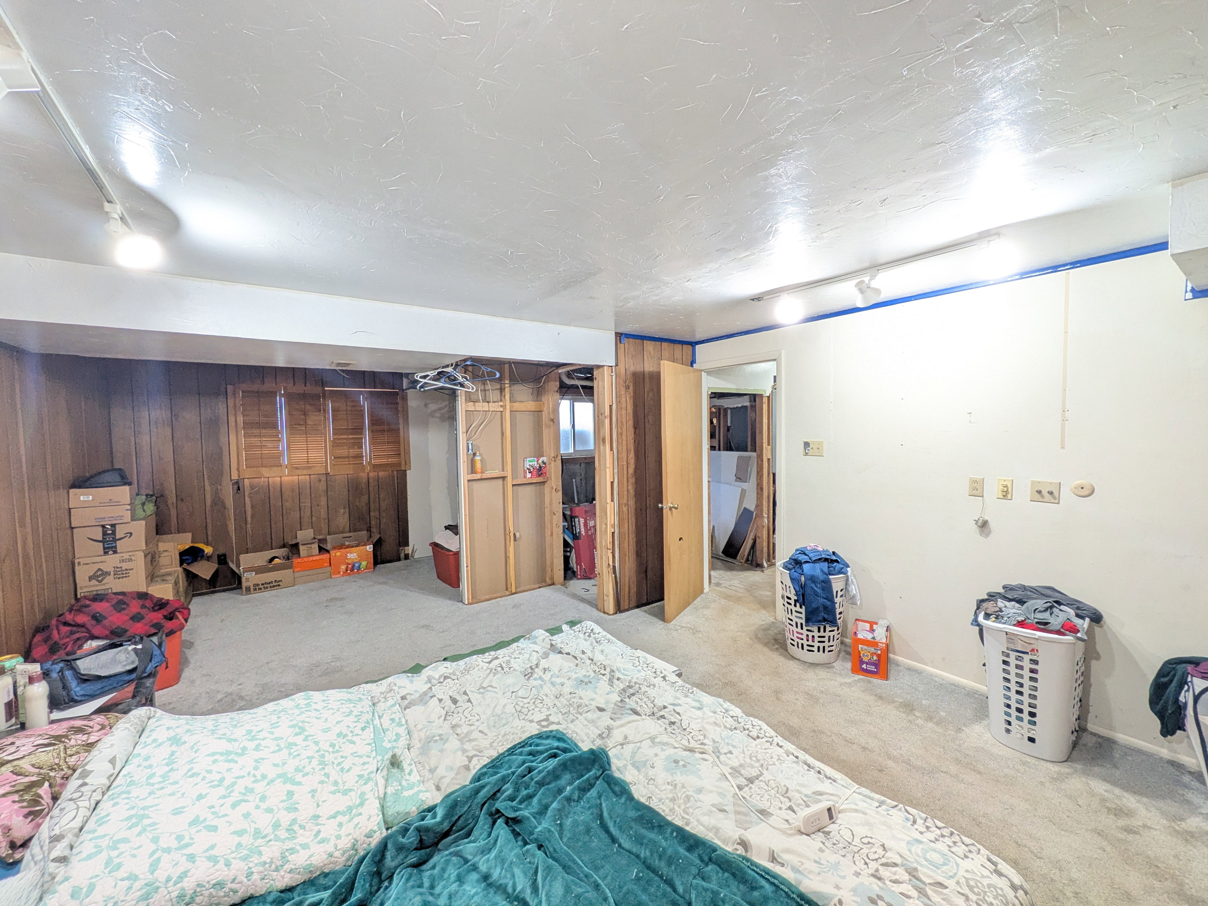Interior room with wood paneling and light-colored walls