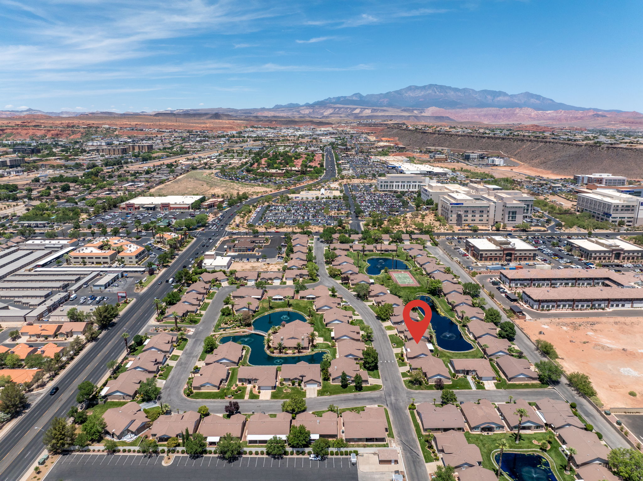 Aerial perspective of a community with residential properties and commercial buildings