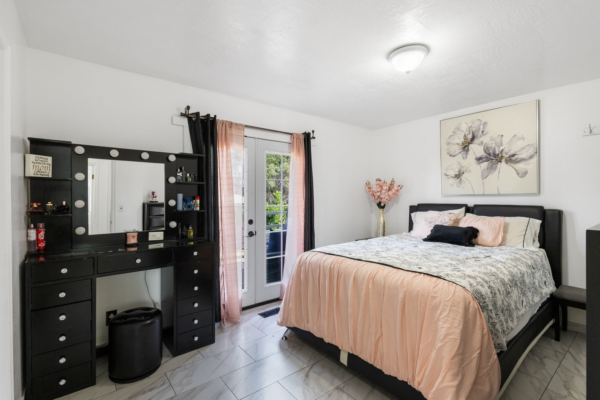 White walls and grey tile flooring create a bright atmosphere