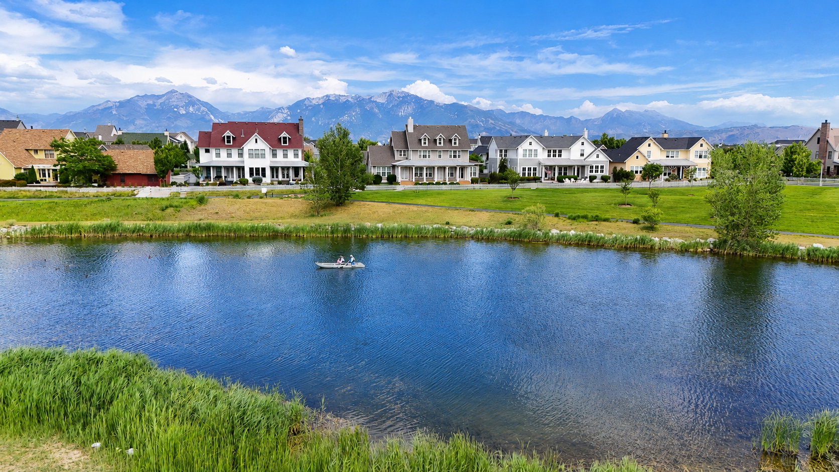Forever views of the Oquirrh Lake surrounded by well manicured grass banks extending useable play space for everyday use and outdoor fun