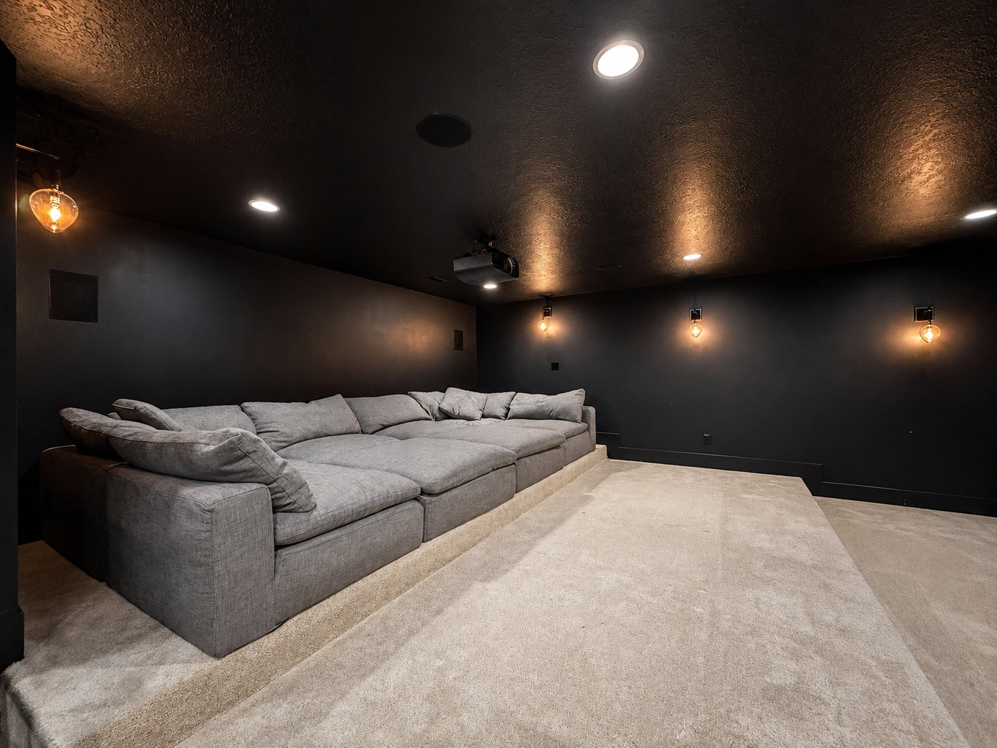Theater room with Restoration Hardware Cloud Couches and tiered seating  options