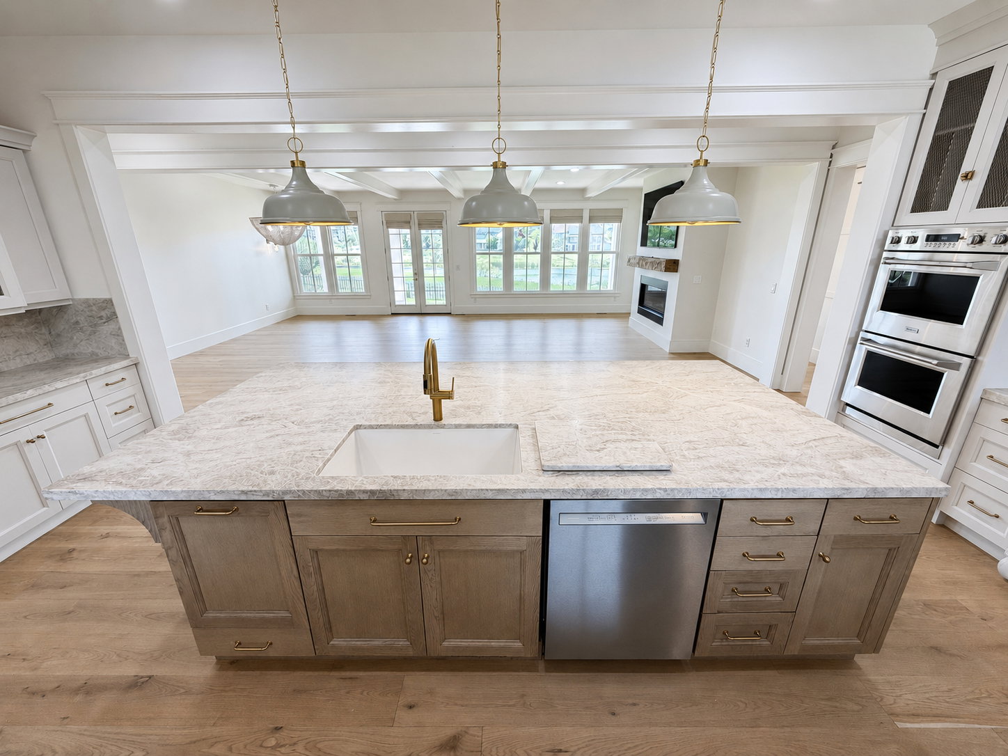 Kitchen island with under mount sink, double trash bin cabinet and dishwasher