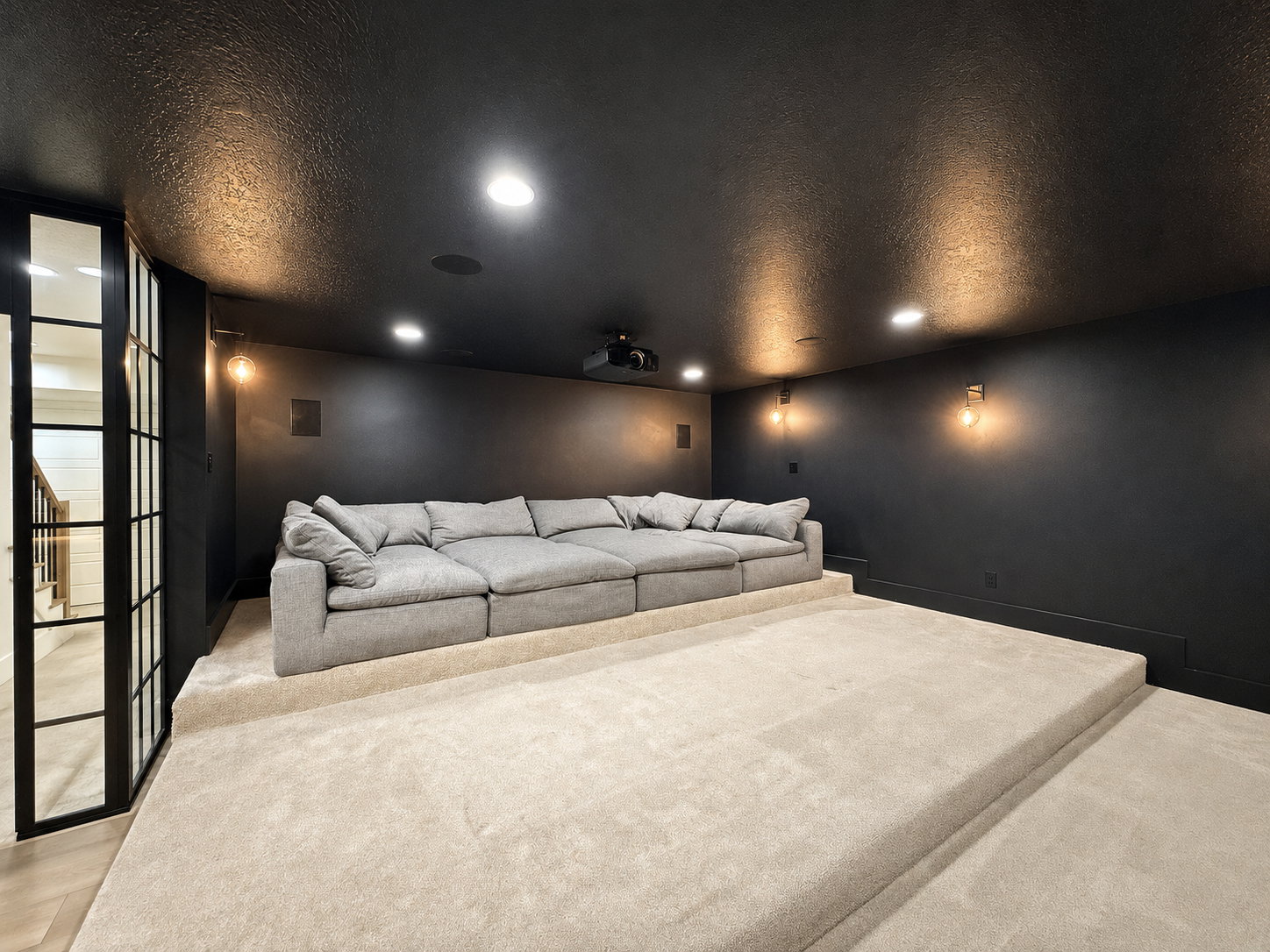 Theater room with high-end ceiling-mounted Sony projector and surround sound